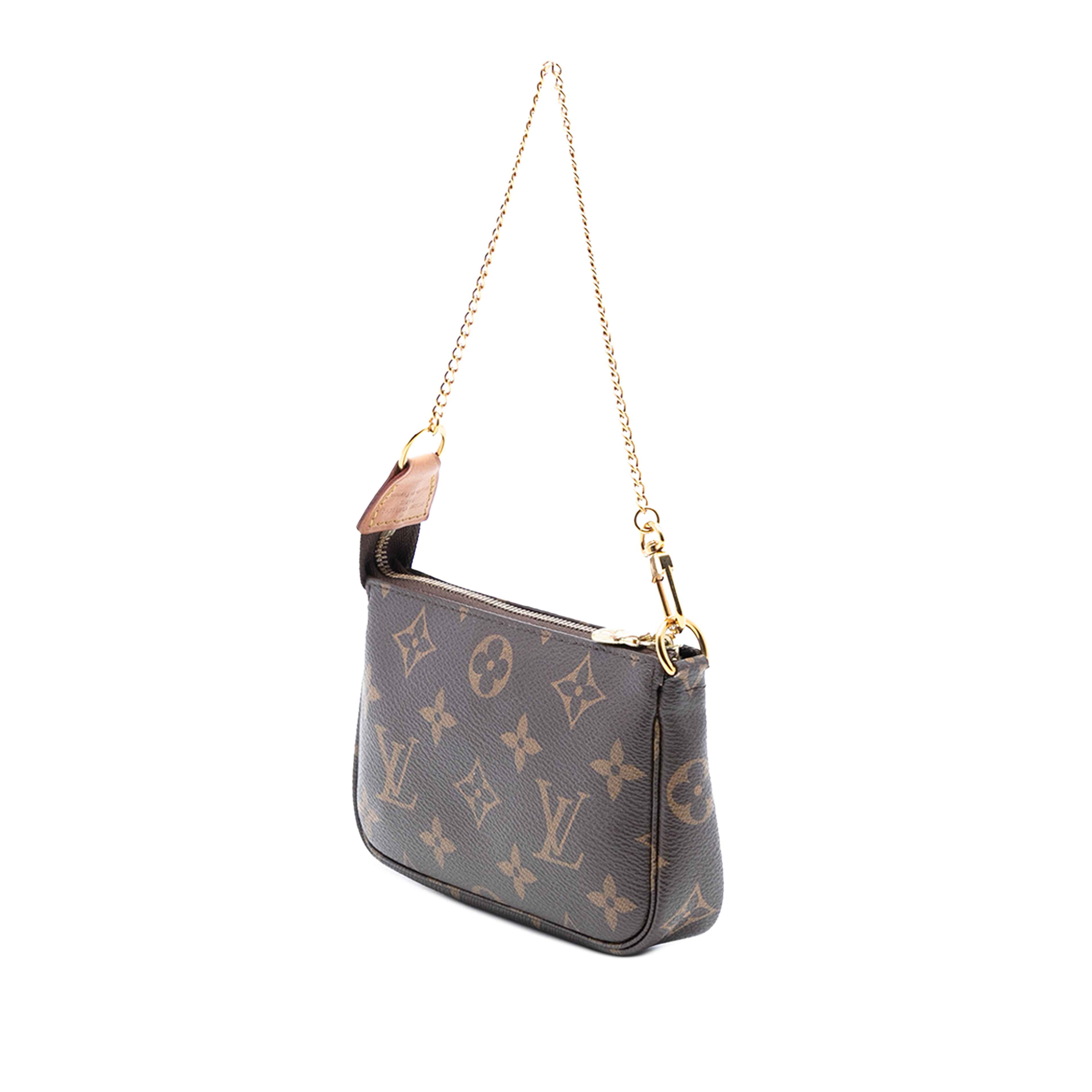 Louis Vuitton Monogram Mini Pochette Accessoires, från Luxclusif, i färgen brun. Klicka för att öppna bilden i stort format