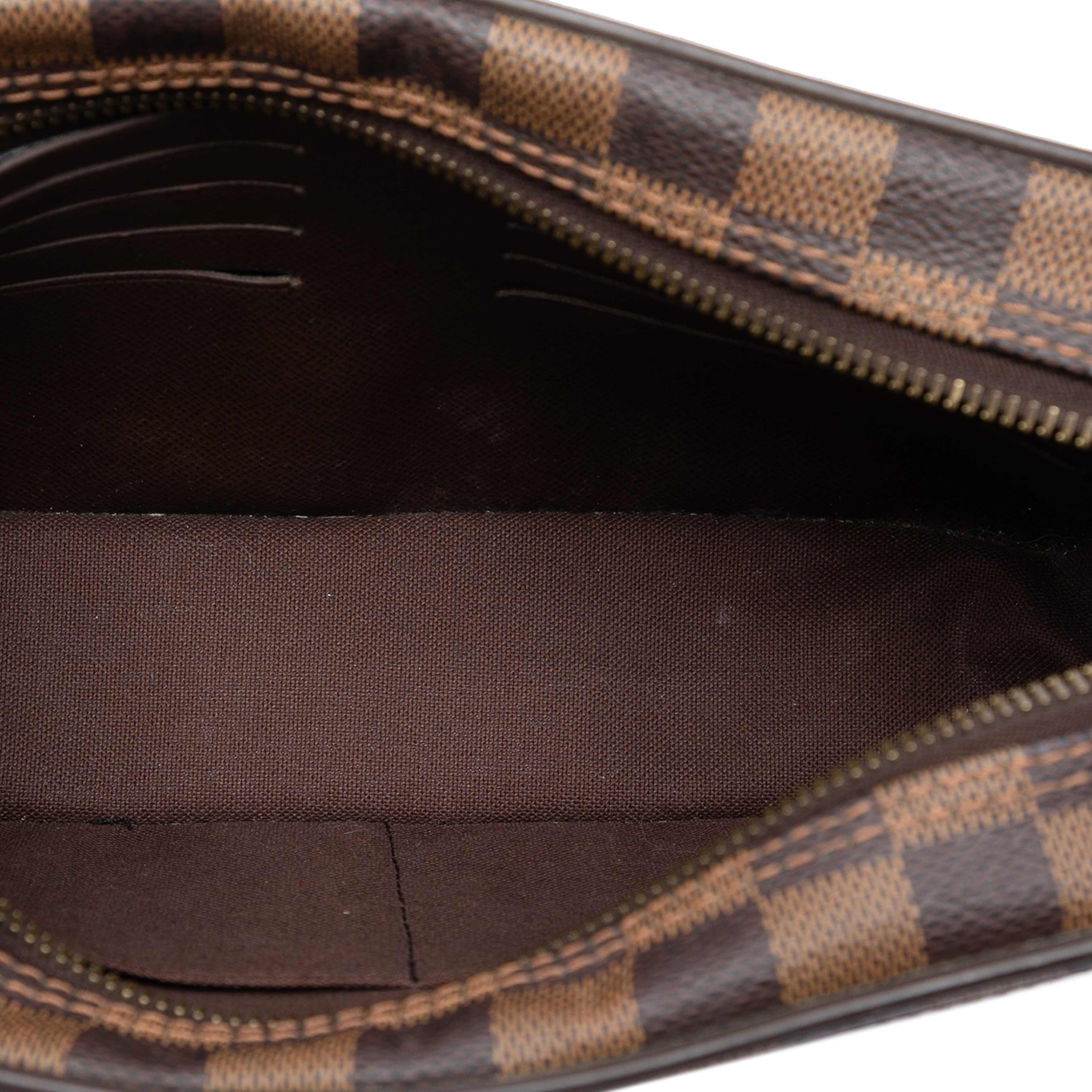 Louis Vuitton Damier Ebene Pochette Saint Paul, från Luxclusif, i färgen brown. Klicka för att öppna bilden i stort format
