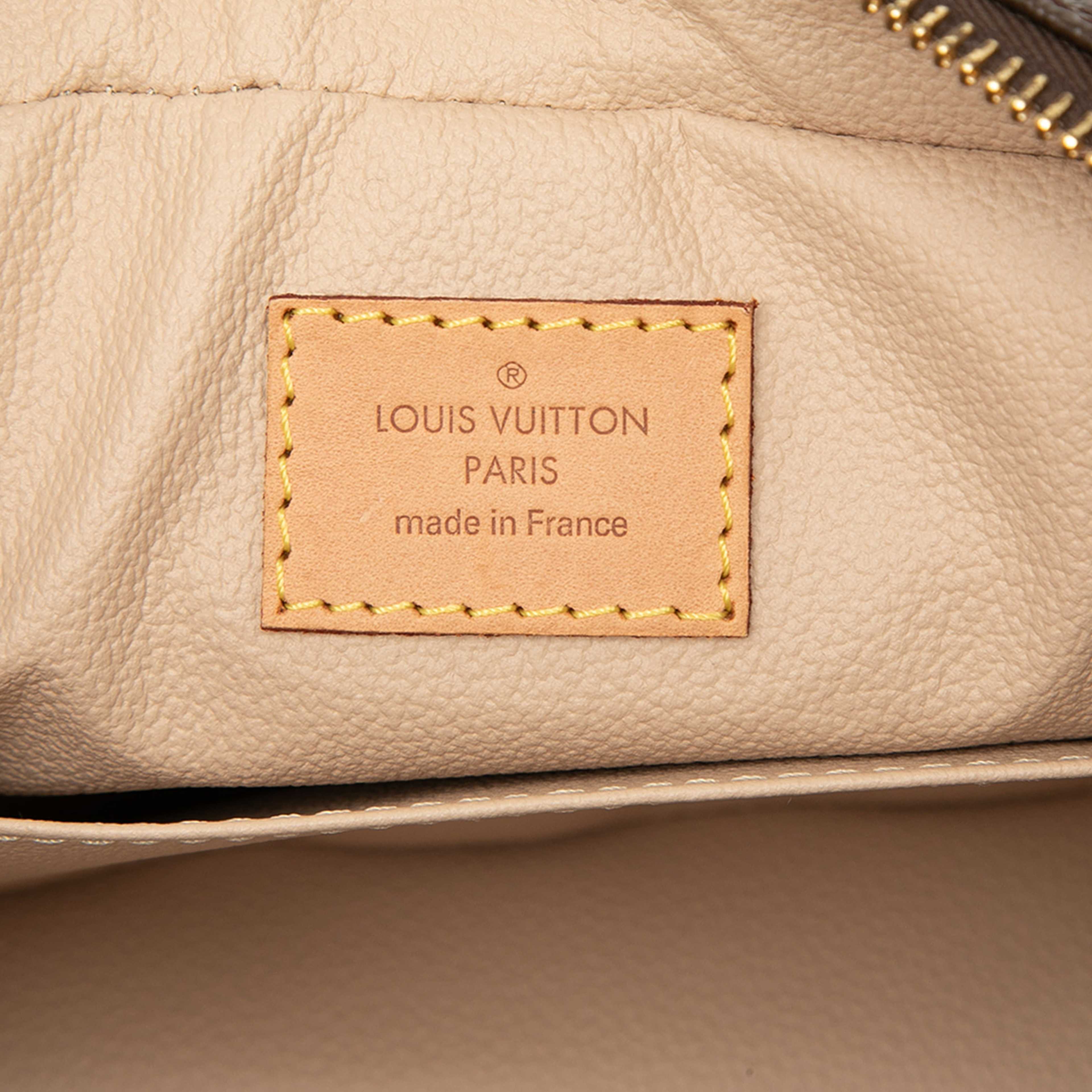 Louis Vuitton Monogram Trousse Toilette 23, från Luxclusif, i färgen brun. Klicka för att öppna bilden i stort format