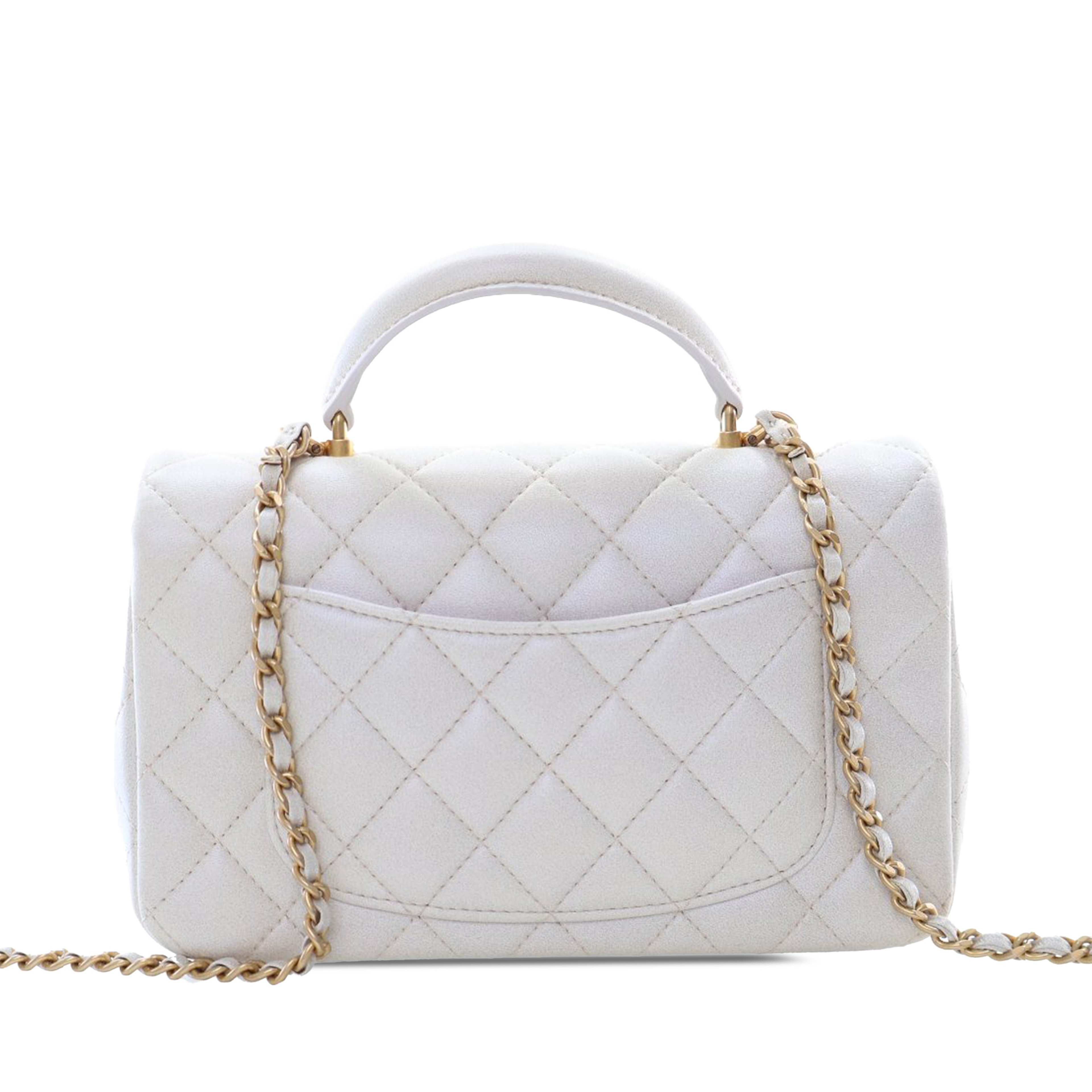 Chanel Mini Rectangular Quilted Iridescent Lambskin Top Handle Flap, från Luxclusif, i färgen white. Klicka för att öppna bilden i stort format