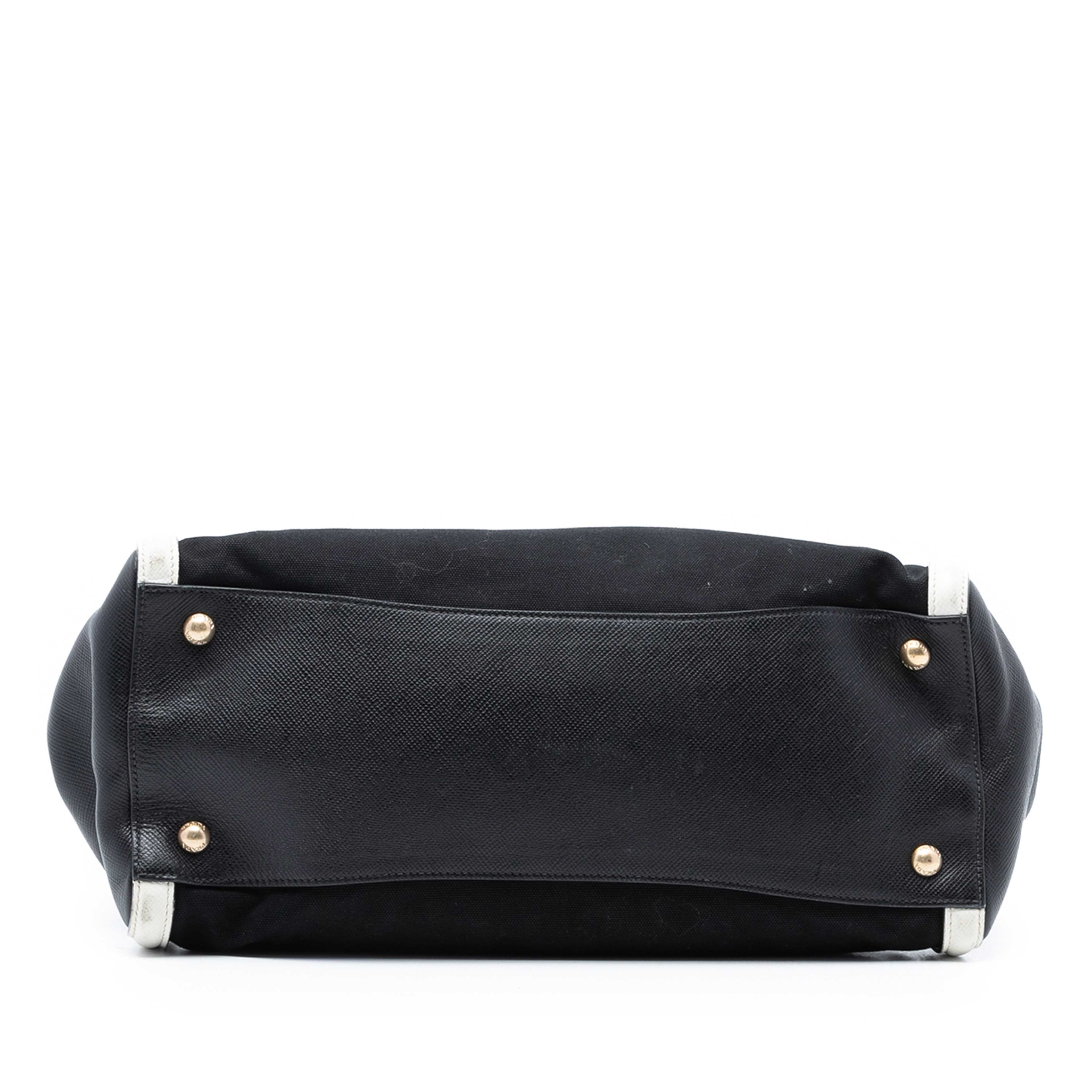 Prada Saffiano Trimmed Canvas Satchel, från Luxclusif, i färgen black. Klicka för att öppna bilden i stort format