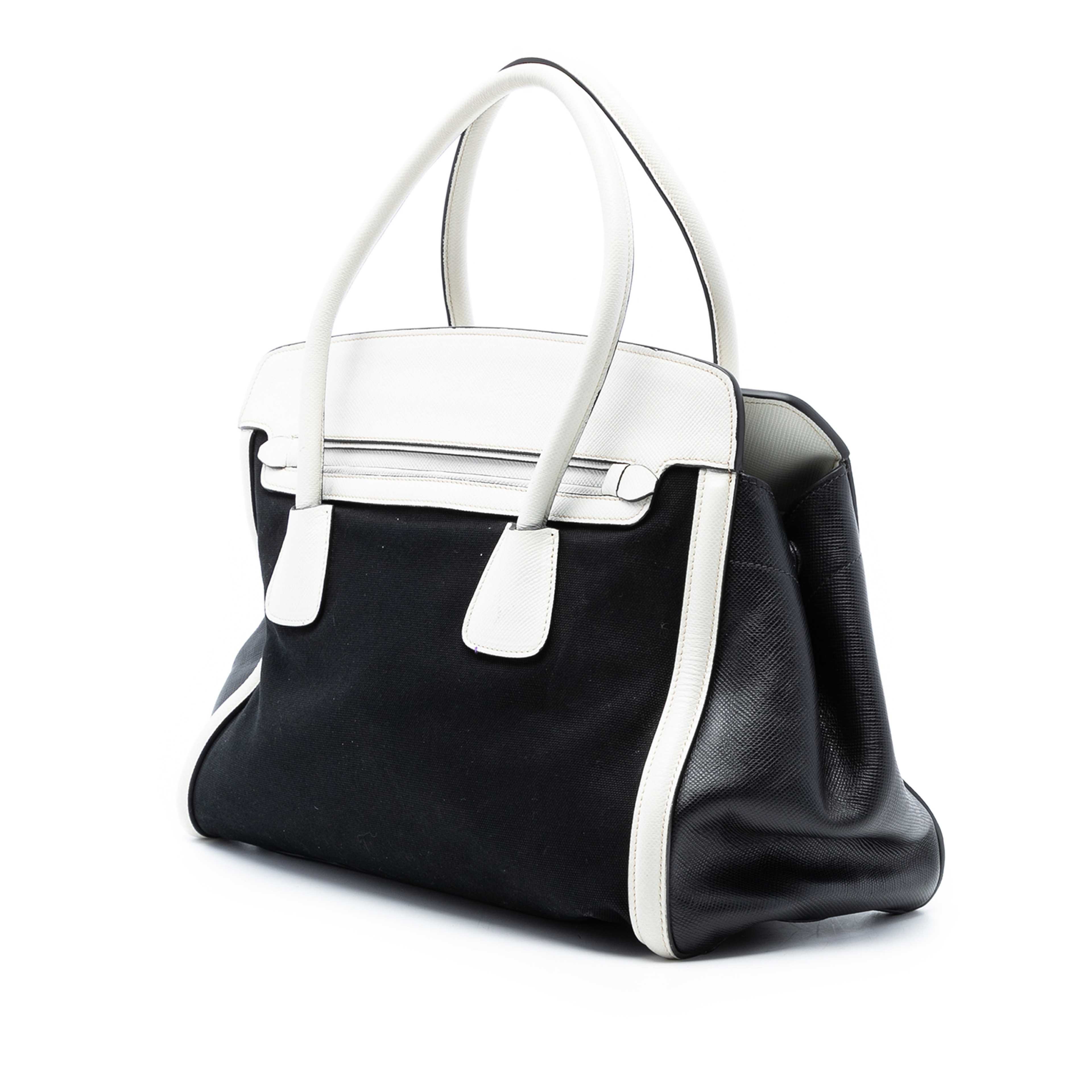 Prada Saffiano Trimmed Canvas Satchel, från Luxclusif, i färgen black. Klicka för att öppna bilden i stort format