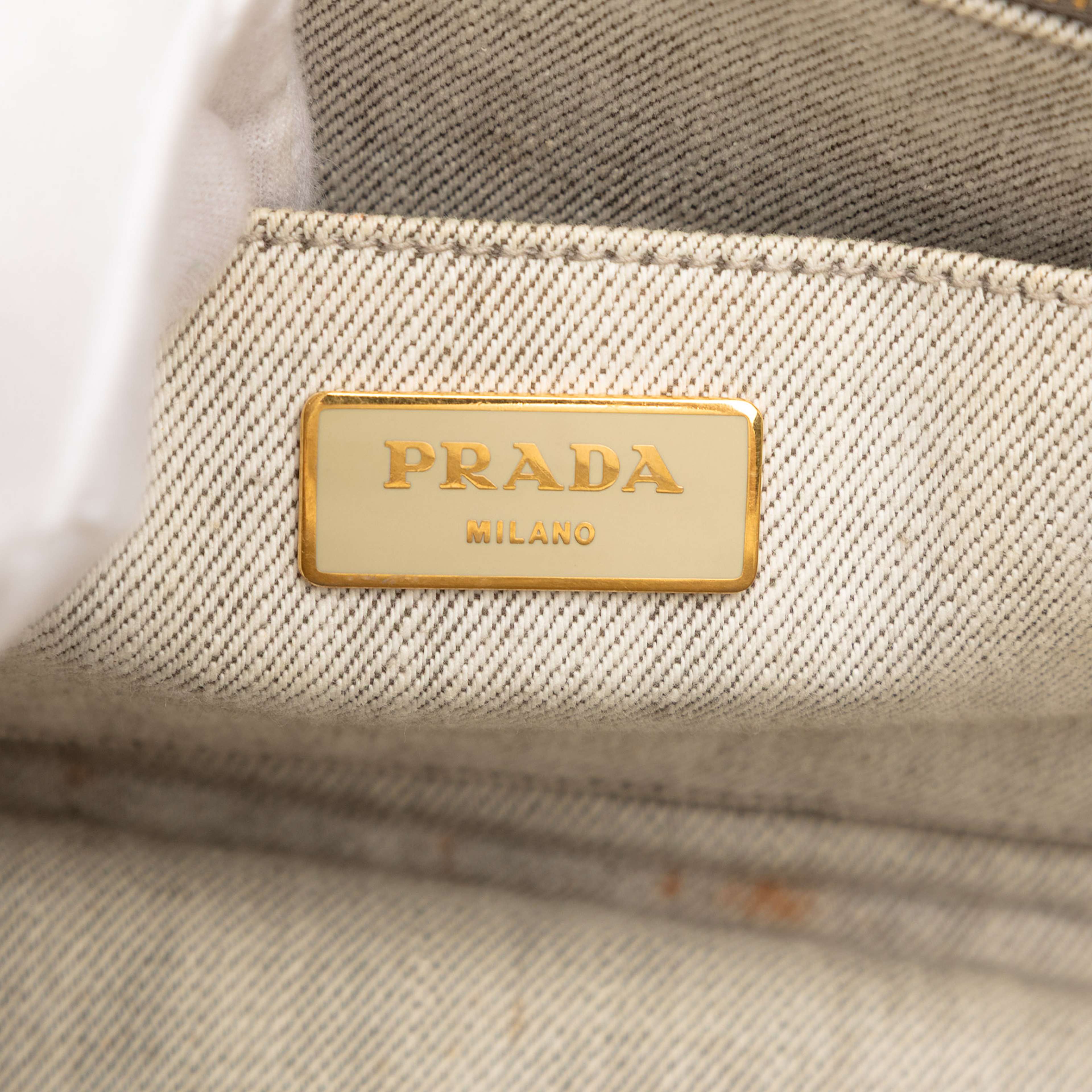 Prada Small Denim Canapa Logo Satchel, från Luxclusif, i färgen light gray. Klicka för att öppna bilden i stort format