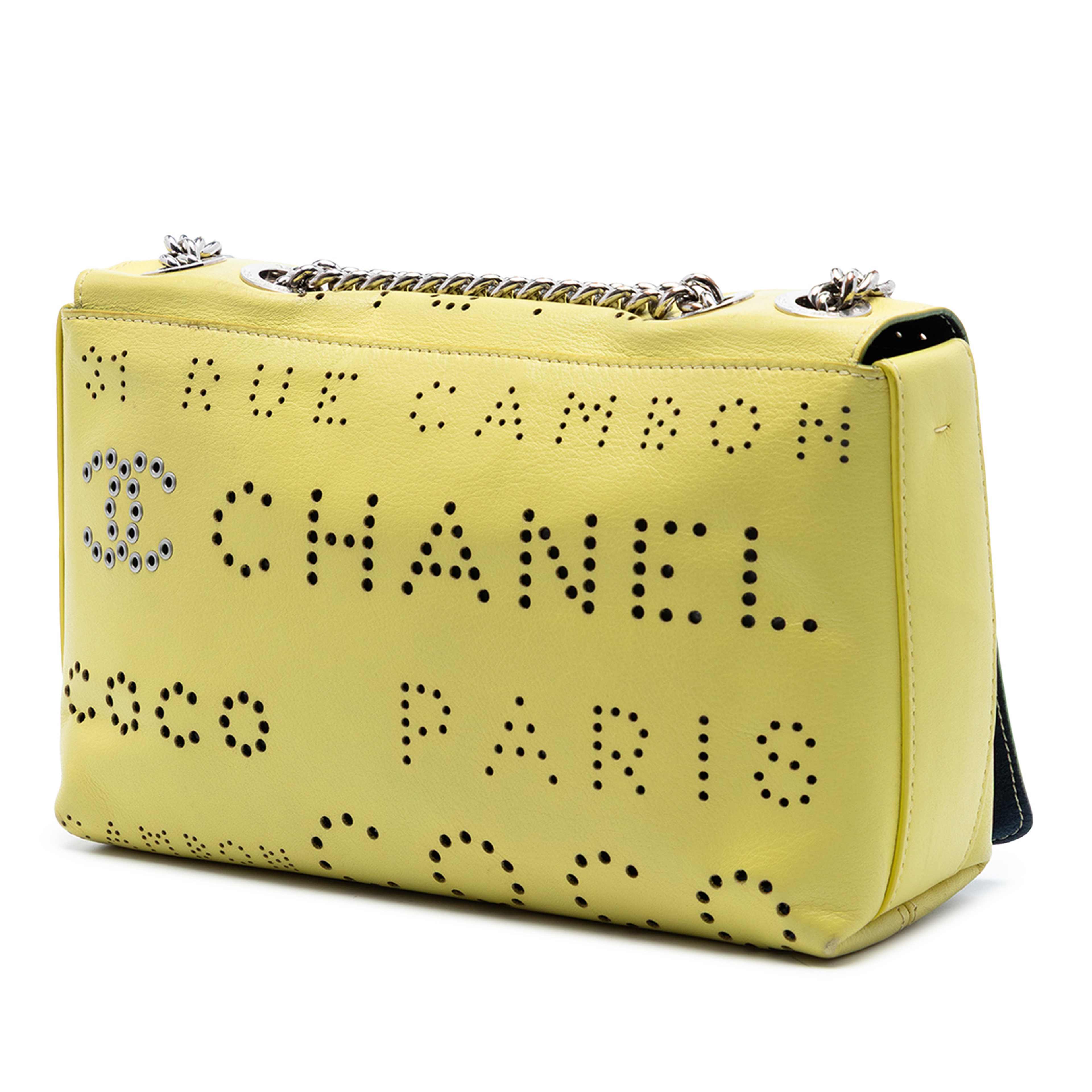 Chanel Perforated Calfskin Logo Eyelet Flap, från Luxclusif, i färgen gul. Klicka för att öppna bilden i stort format