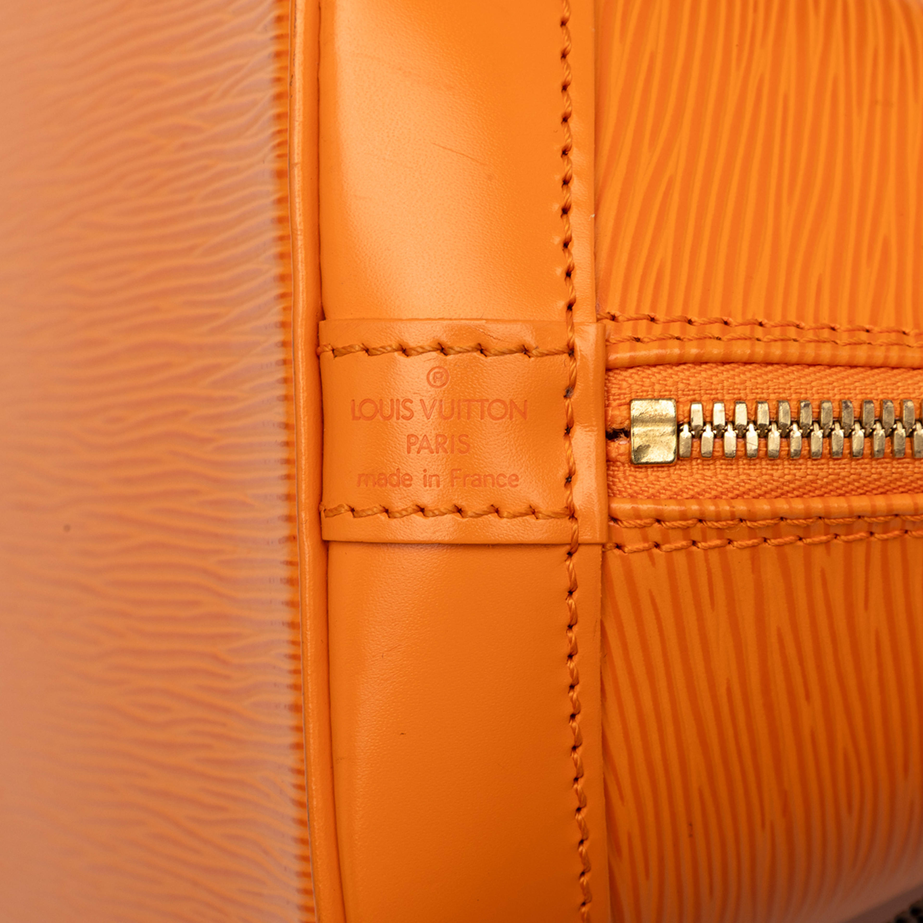 Louis Vuitton Epi Alma Pm, från Luxclusif, i färgen orange. Klicka för att öppna bilden i stort format