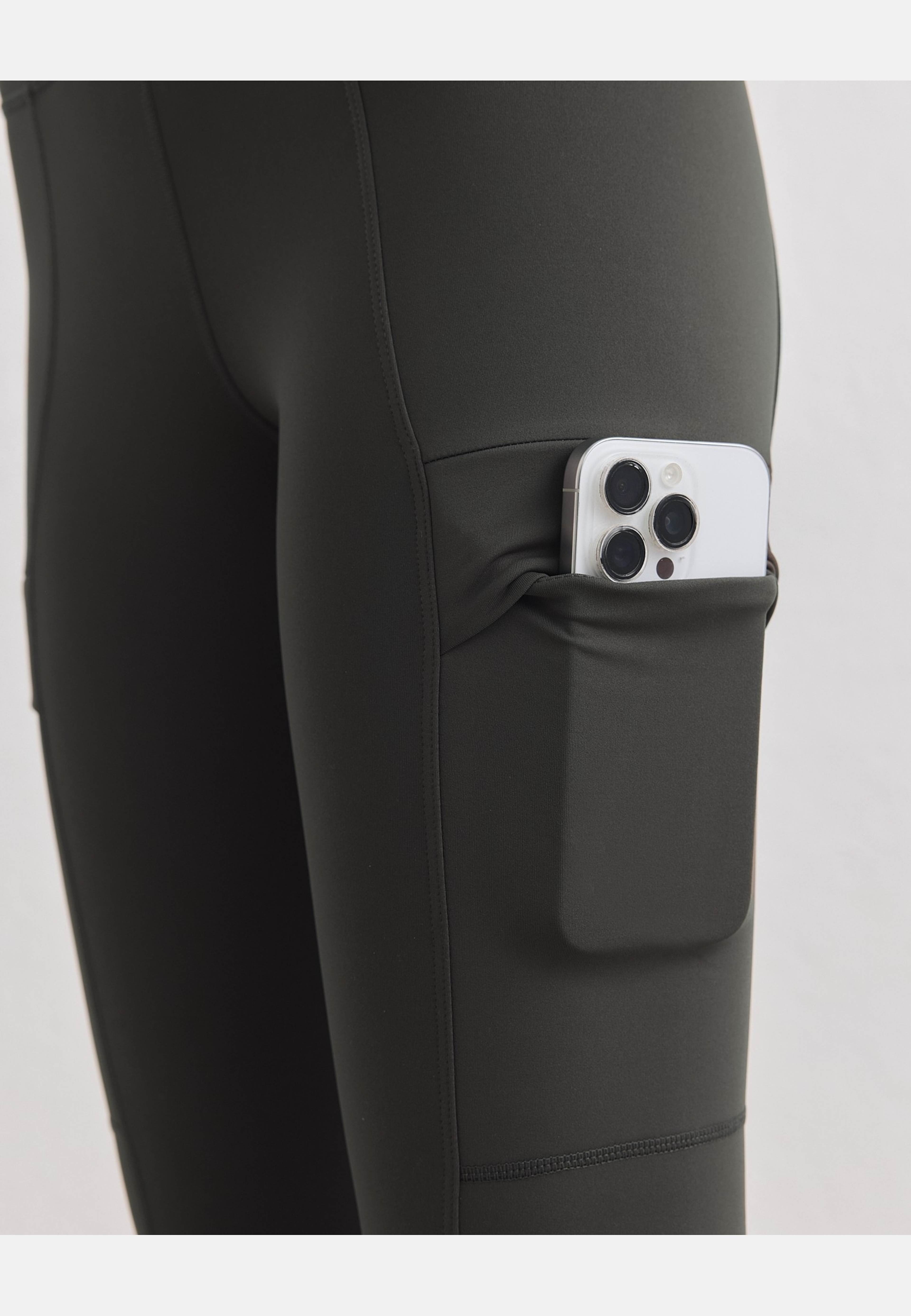 Warming Pocket Tights, från aim'n, i färgen dark ivy. Klicka för att öppna bilden i stort format