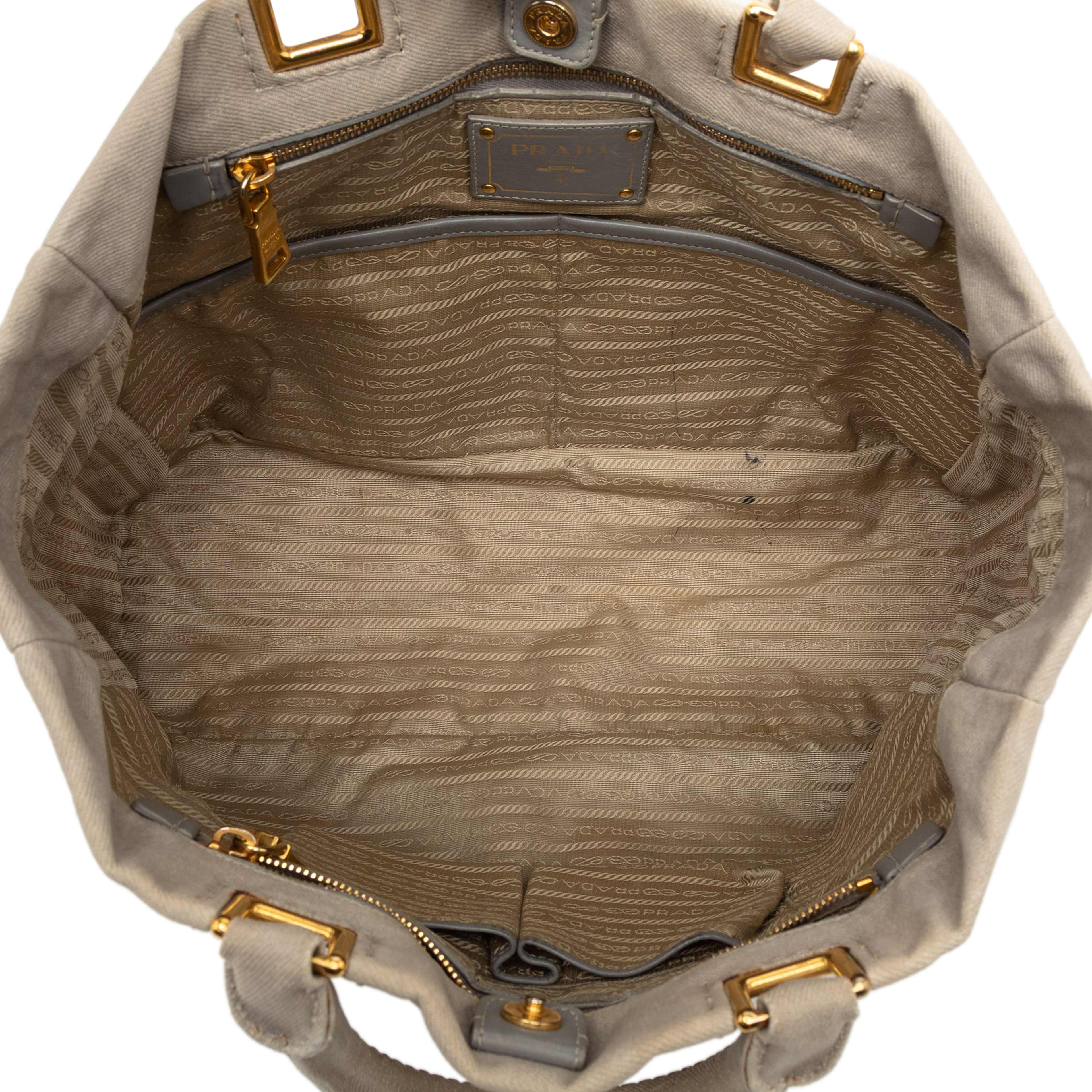 Prada Denim Canapa Logo Satchel, från Luxclusif, i färgen light beige. Klicka för att öppna bilden i stort format