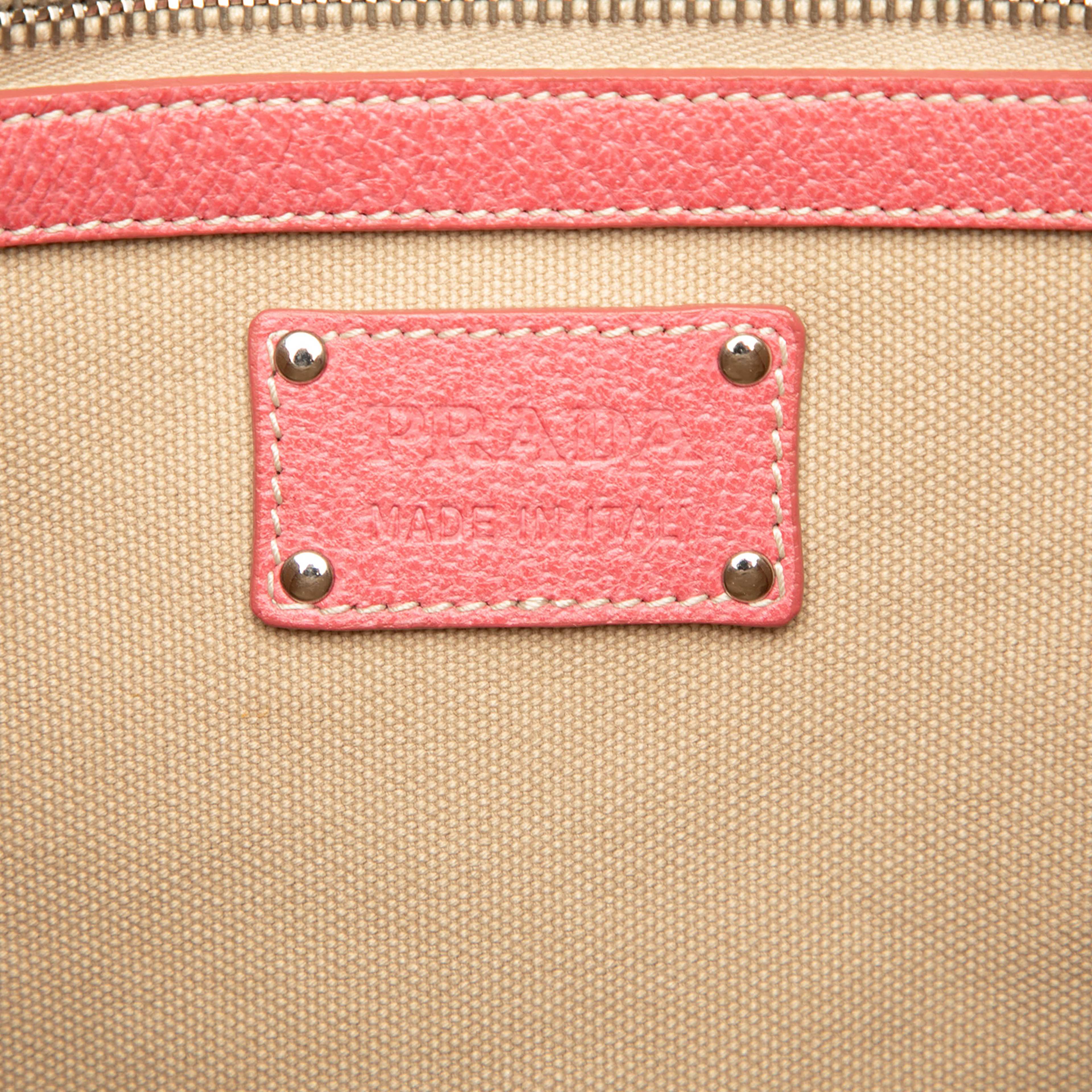 Prada Studded Leather Trimmed Canvas Front Pocket Tote, från Luxclusif, i färgen beige. Klicka för att öppna bilden i stort format