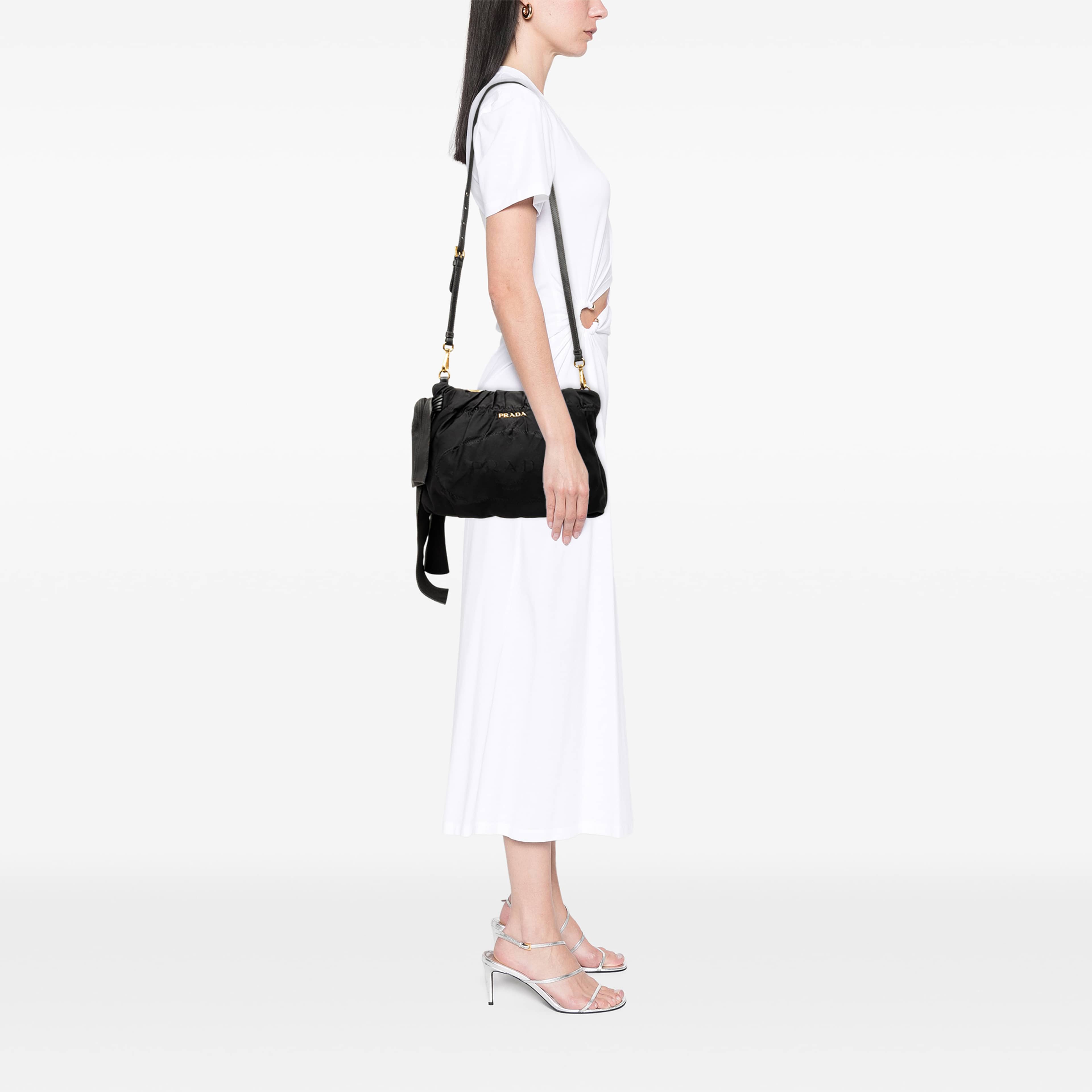 Prada Tessuto Canapa Logo Bow Crossbody, från Luxclusif, i färgen svart. Klicka för att öppna bilden i stort format