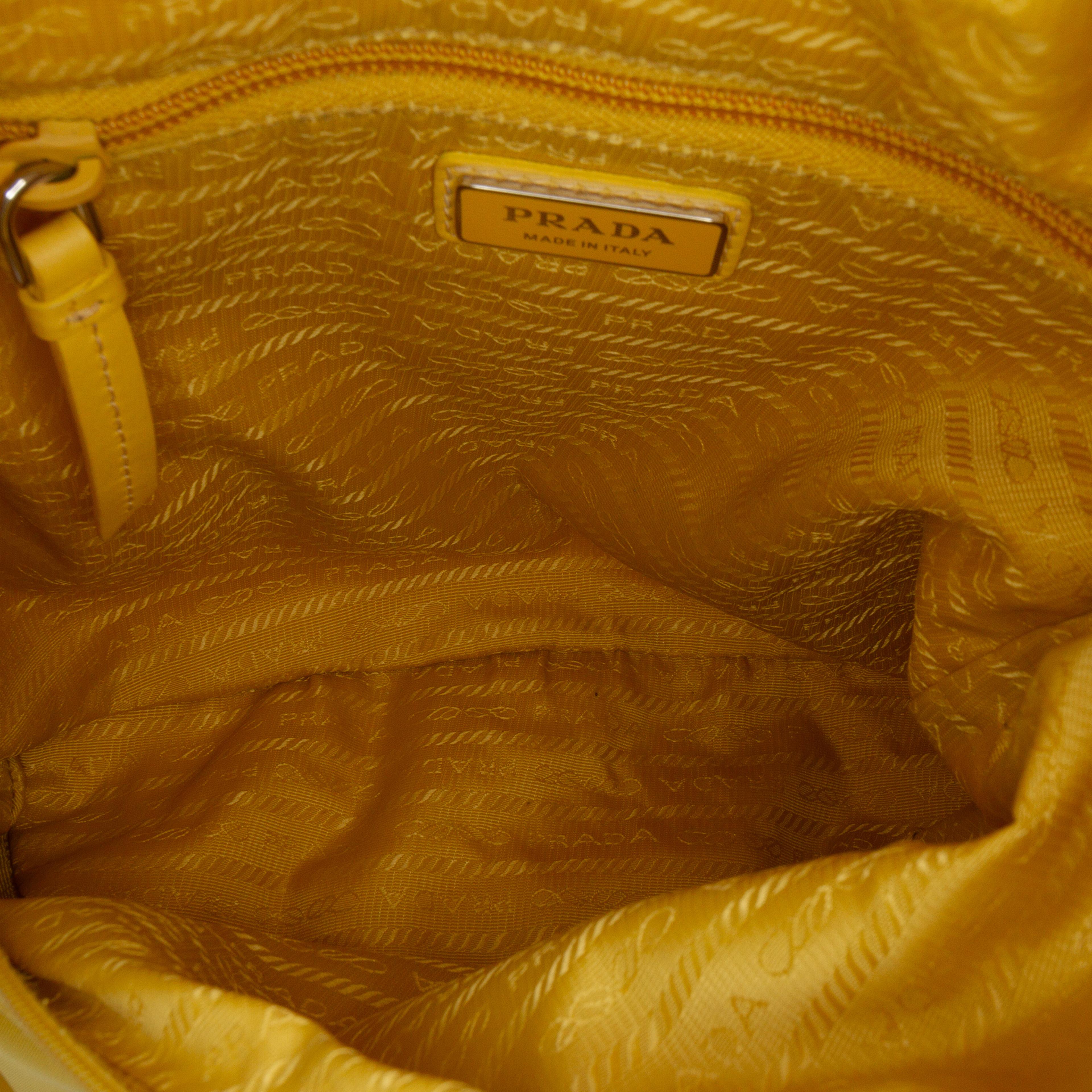 Prada Re Nylon Sling Bag, från Luxclusif, i färgen yellow. Klicka för att öppna bilden i stort format