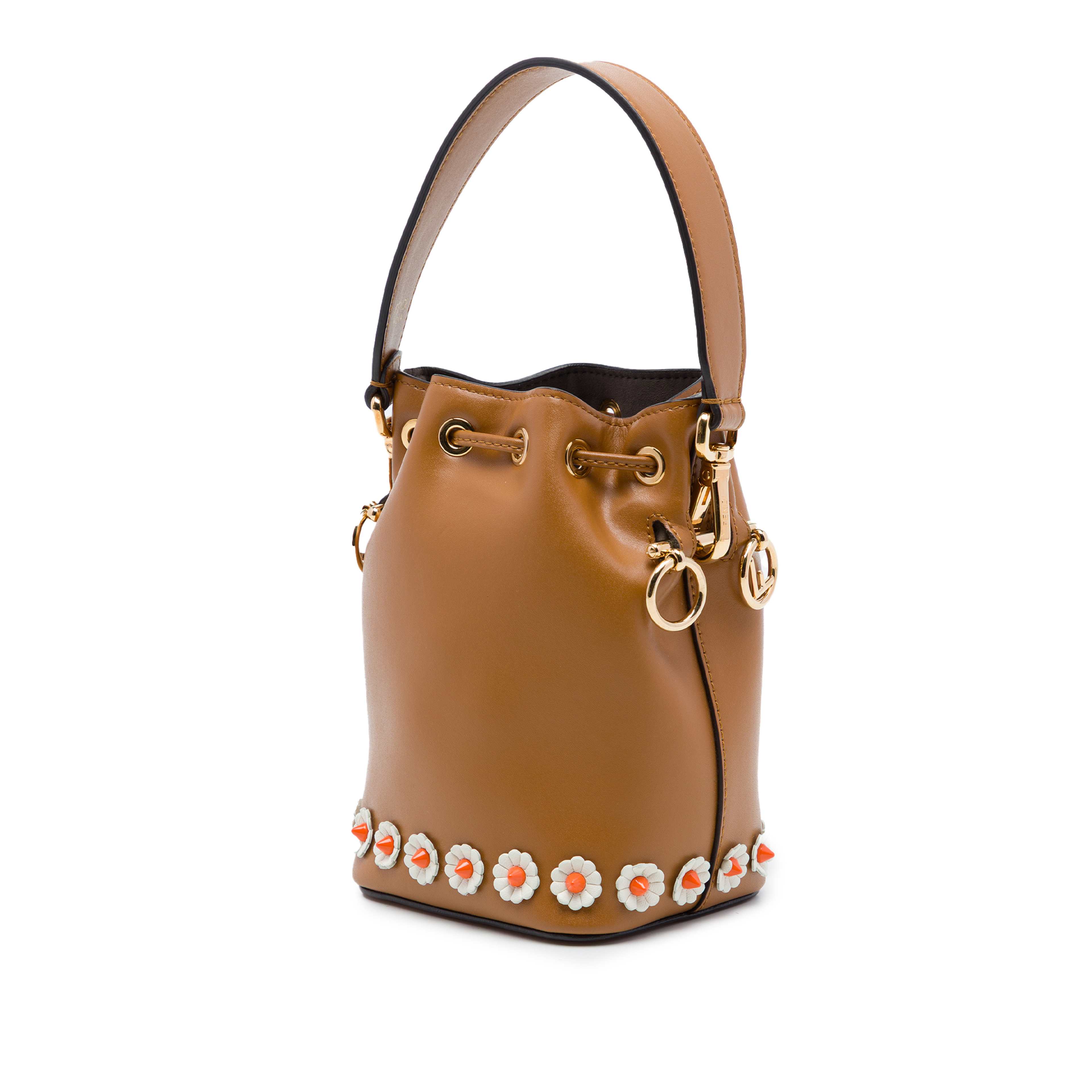 Fendi Mini Leather Studded Floral Mon Tresor Bucket Bag, från Luxclusif, i färgen brun. Klicka för att öppna bilden i stort format