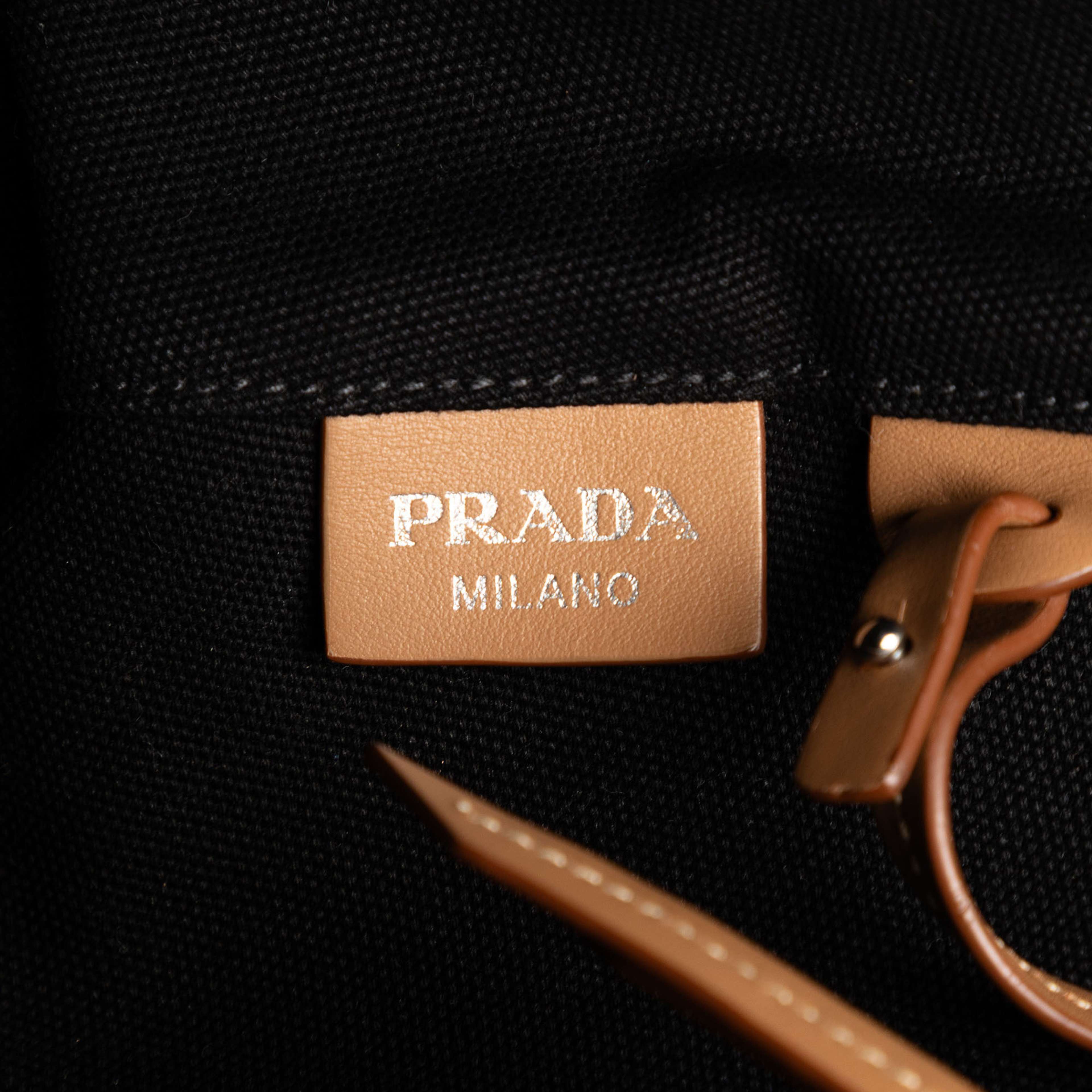 Prada Canvas Canapa Logo Satchel, från Luxclusif, i färgen black. Klicka för att öppna bilden i stort format
