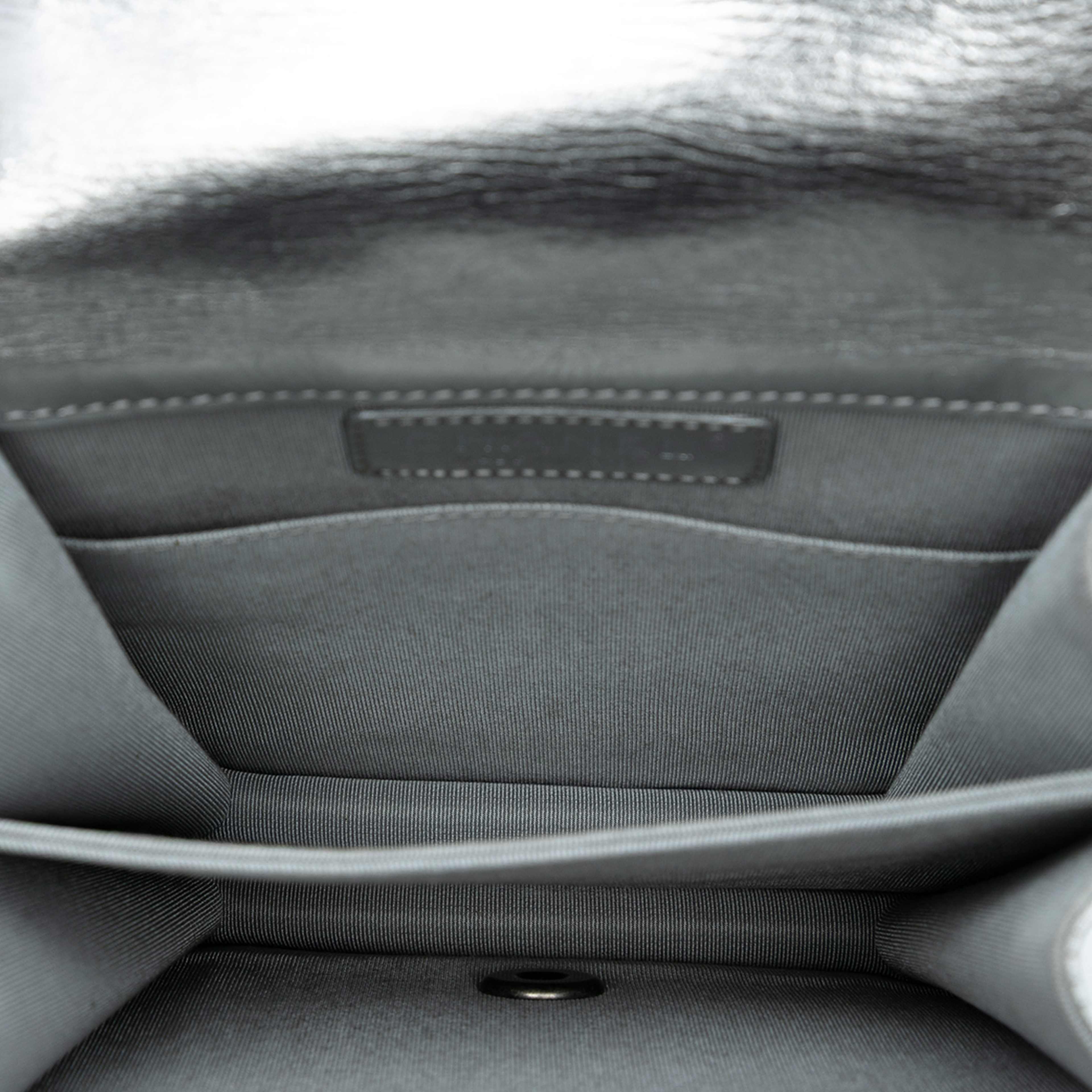 Chanel Quilted Metallic Calfskin North South Boy Flap, från Luxclusif, i färgen silver. Klicka för att öppna bilden i stort format