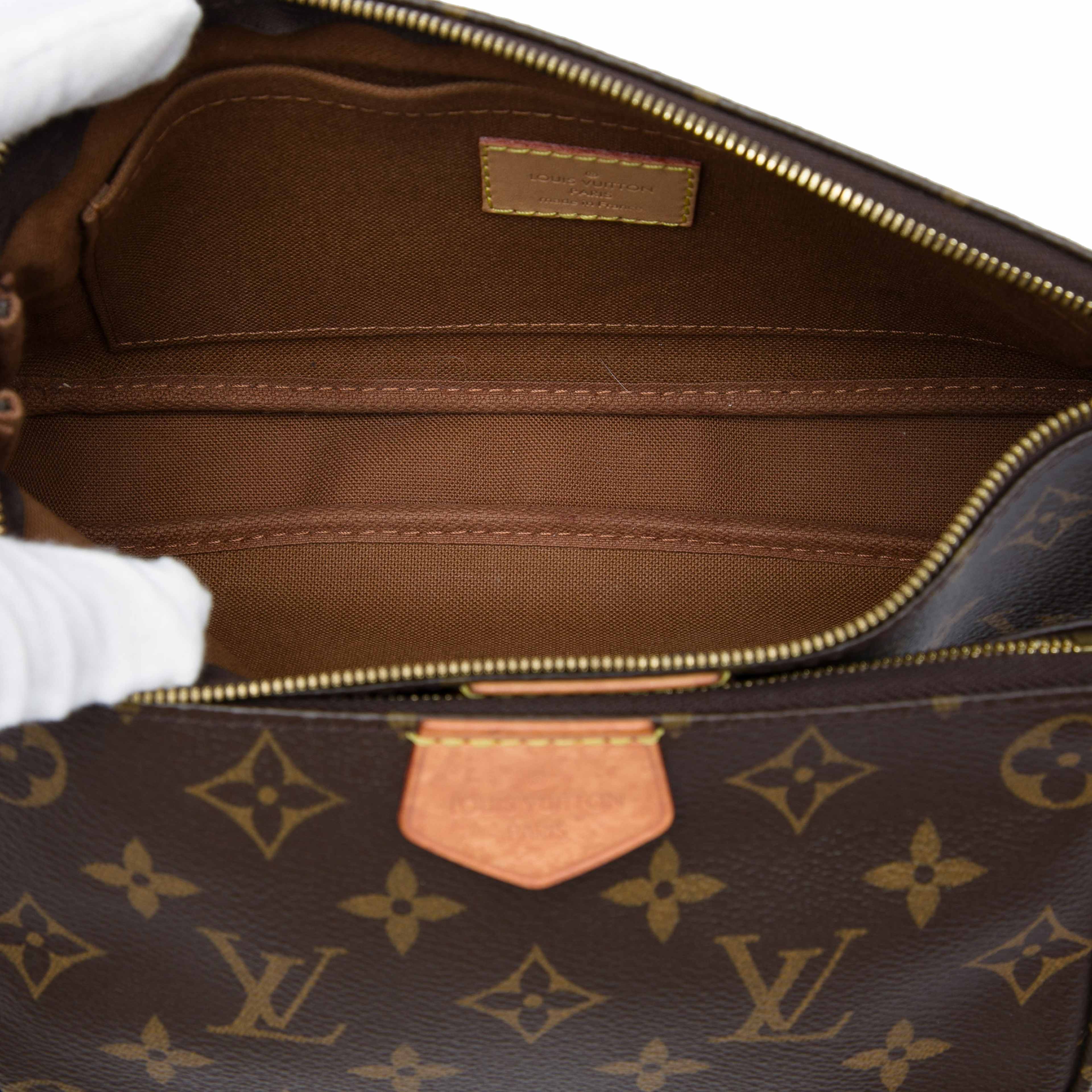 Louis Vuitton Monogram Multi Pochette Accessoires, från Luxclusif, i färgen brun. Klicka för att öppna bilden i stort format