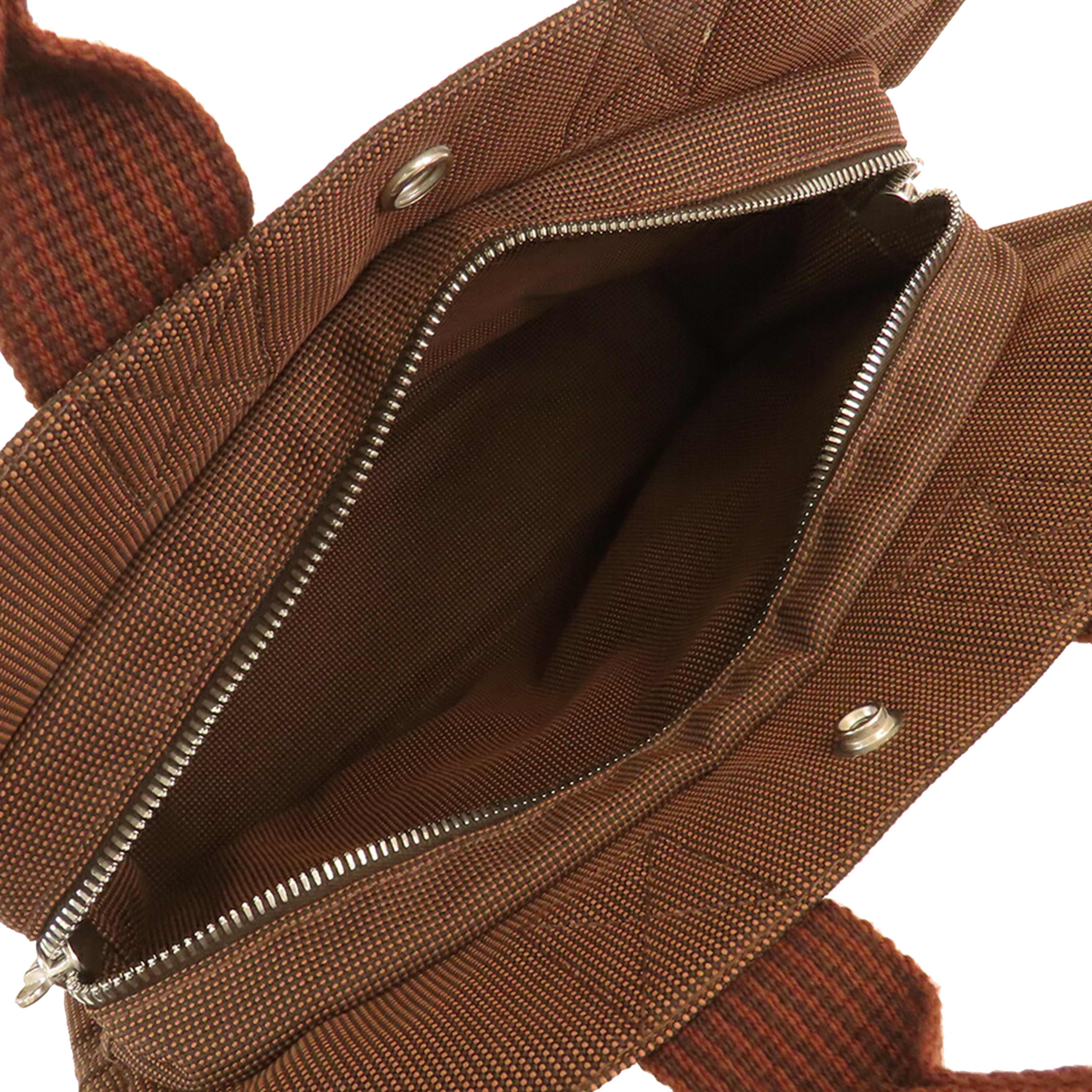 Hermès Canvas Herline Pm, från Luxclusif, i färgen brown. Klicka för att öppna bilden i stort format