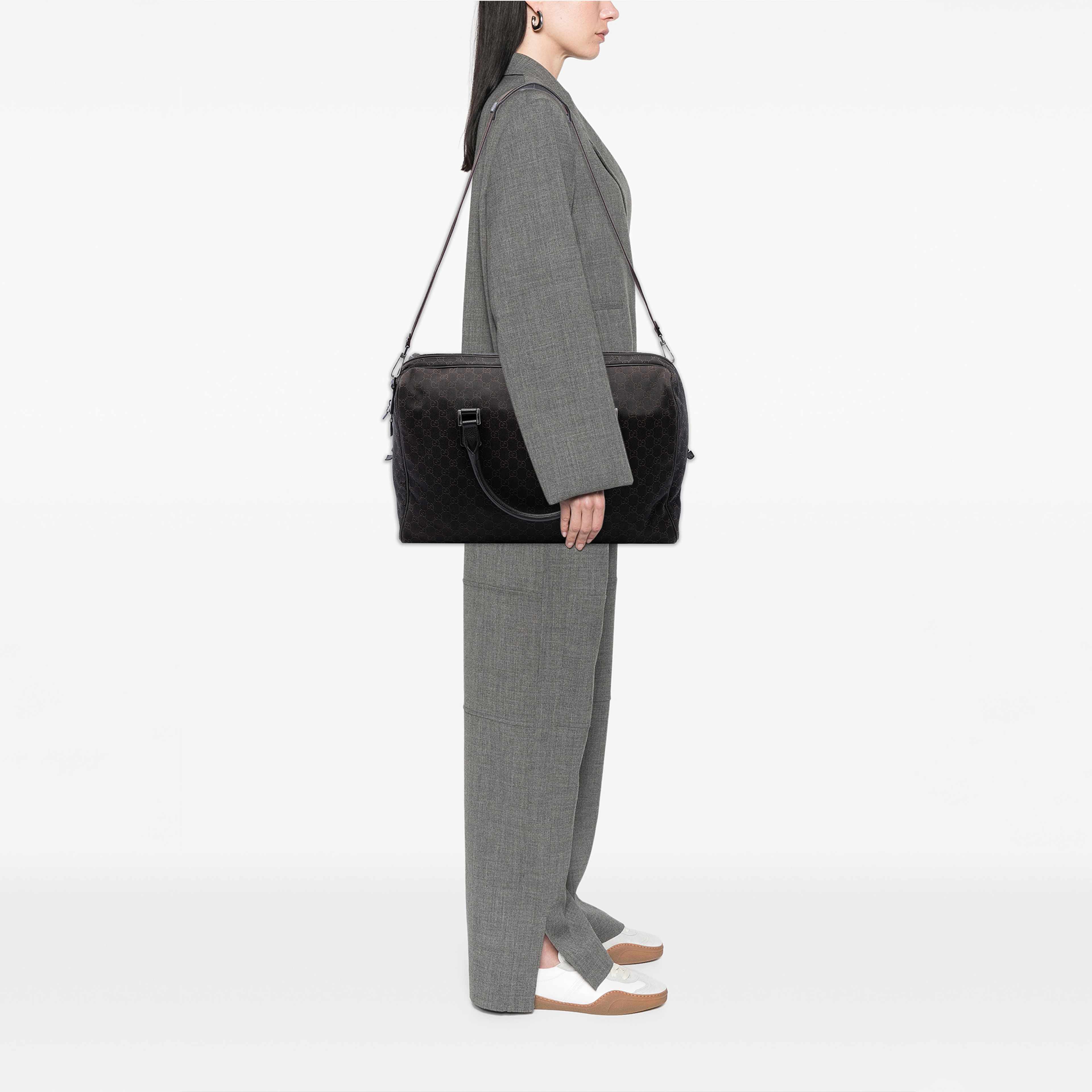 Gucci Gg Denim Travel Bag, från Luxclusif, i färgen brun. Klicka för att öppna bilden i stort format