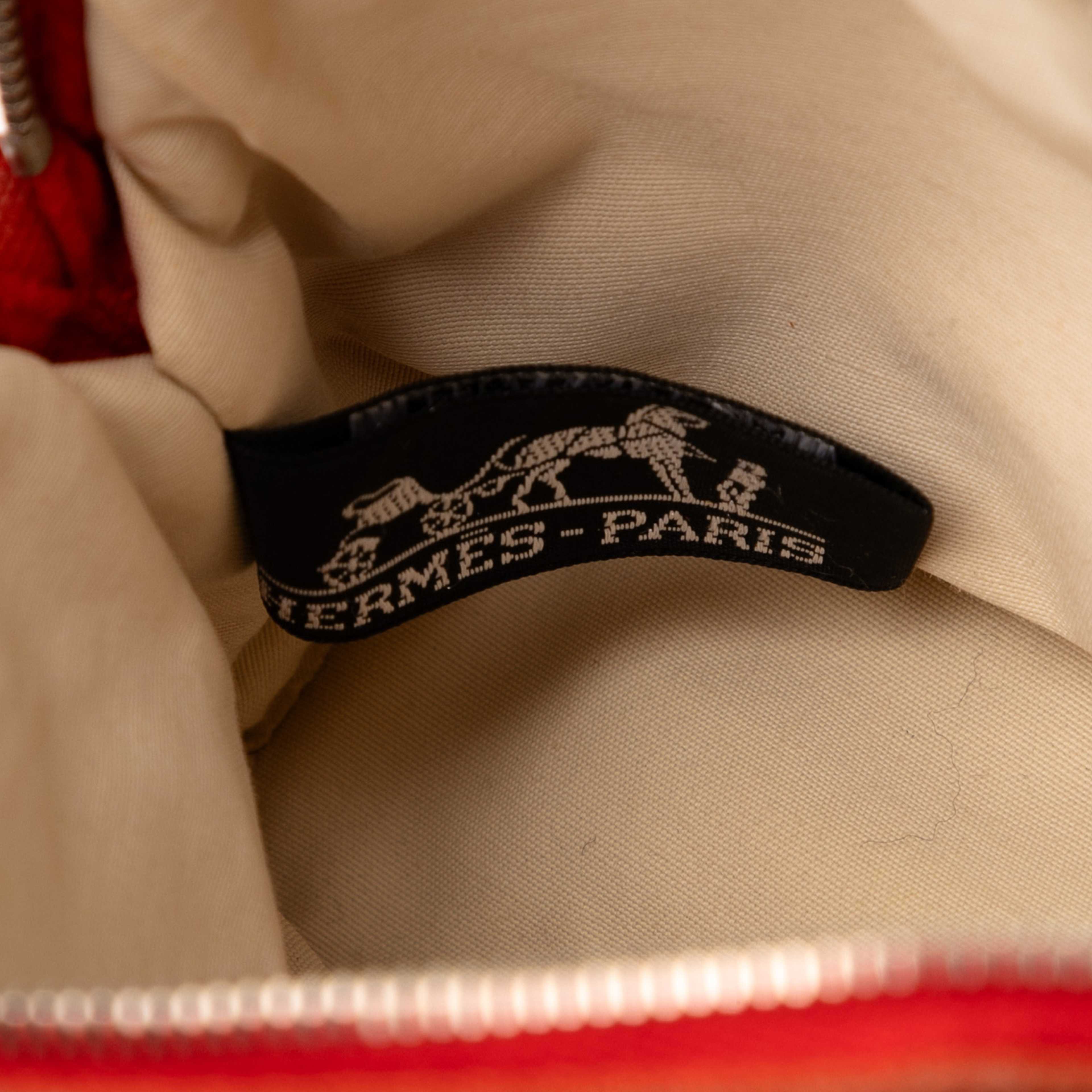 Hermès Mini Toile Bolide Case, från Luxclusif, i färgen orange. Klicka för att öppna bilden i stort format