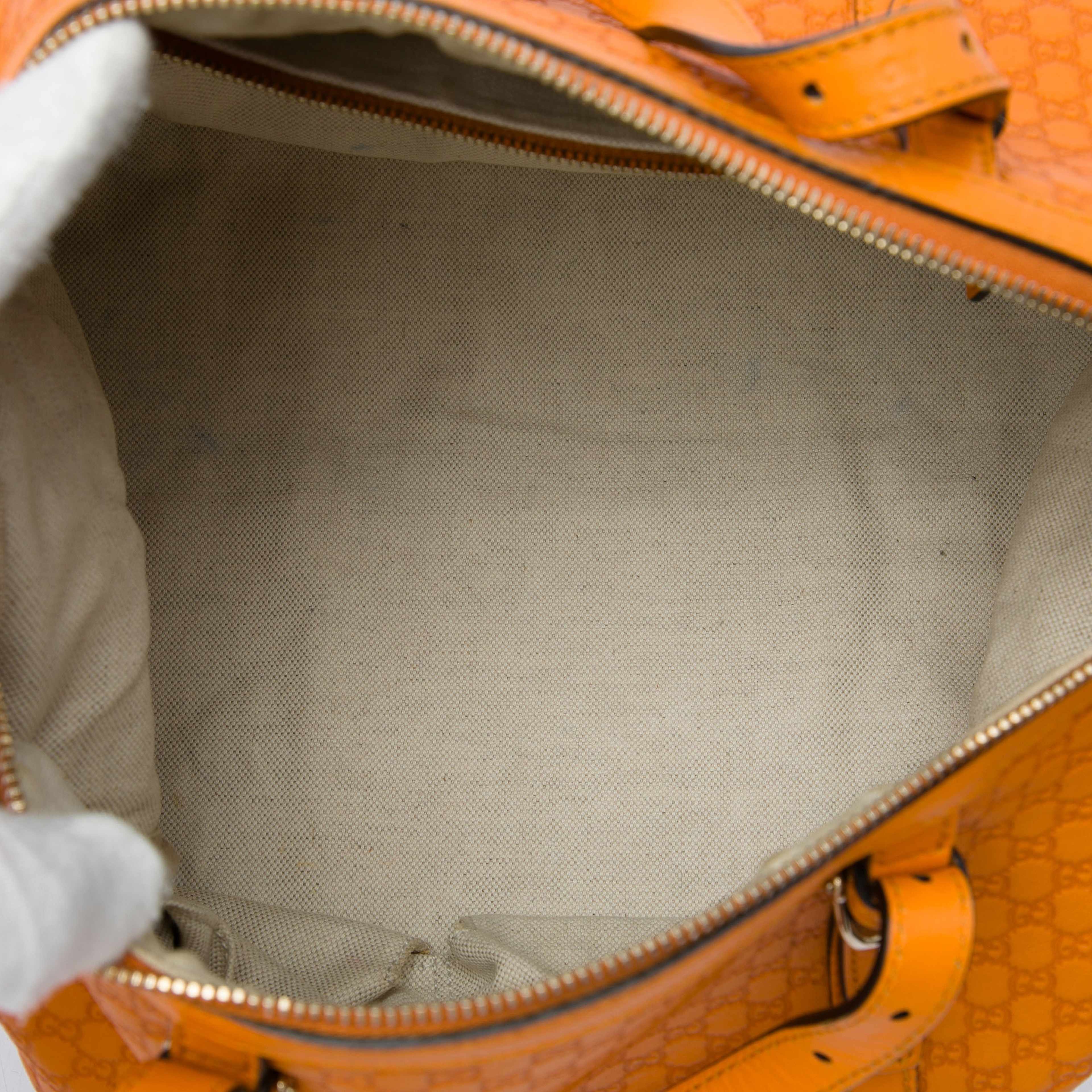 Gucci Microguccissima Nice Boston Bag, från Luxclusif, i färgen orange. Klicka för att öppna bilden i stort format