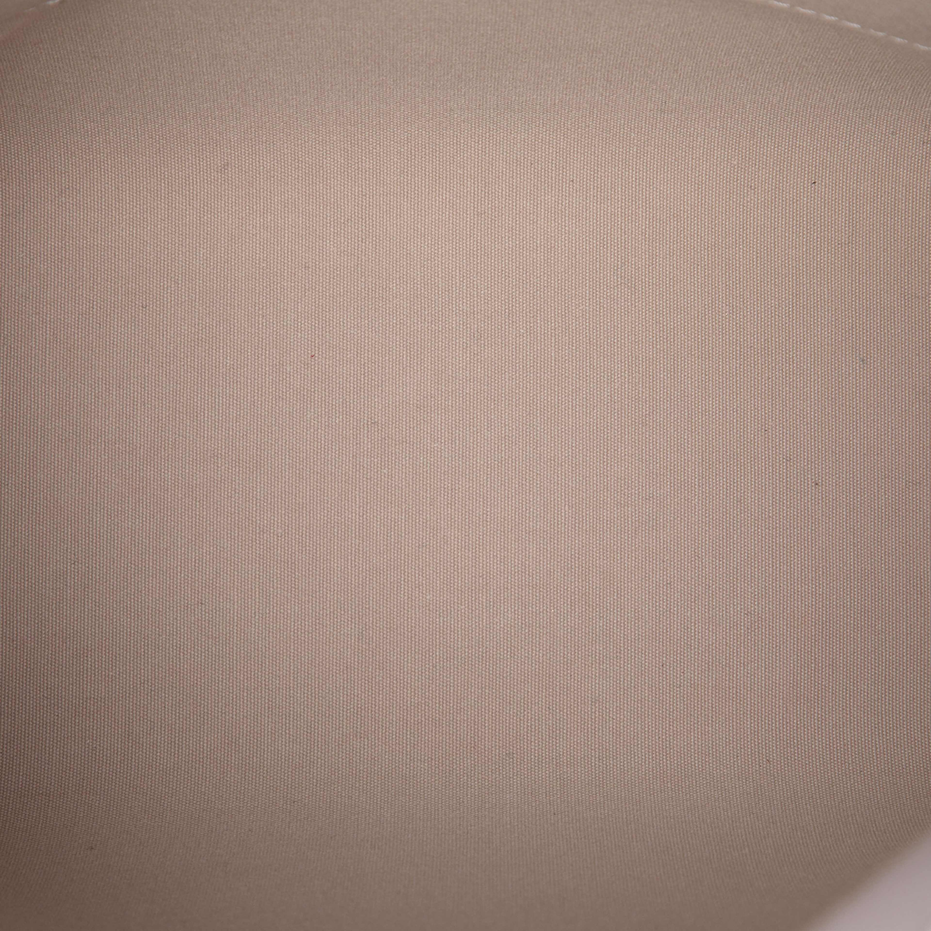 Louis Vuitton Epi Lockit Vertical, från Luxclusif, i färgen white. Klicka för att öppna bilden i stort format