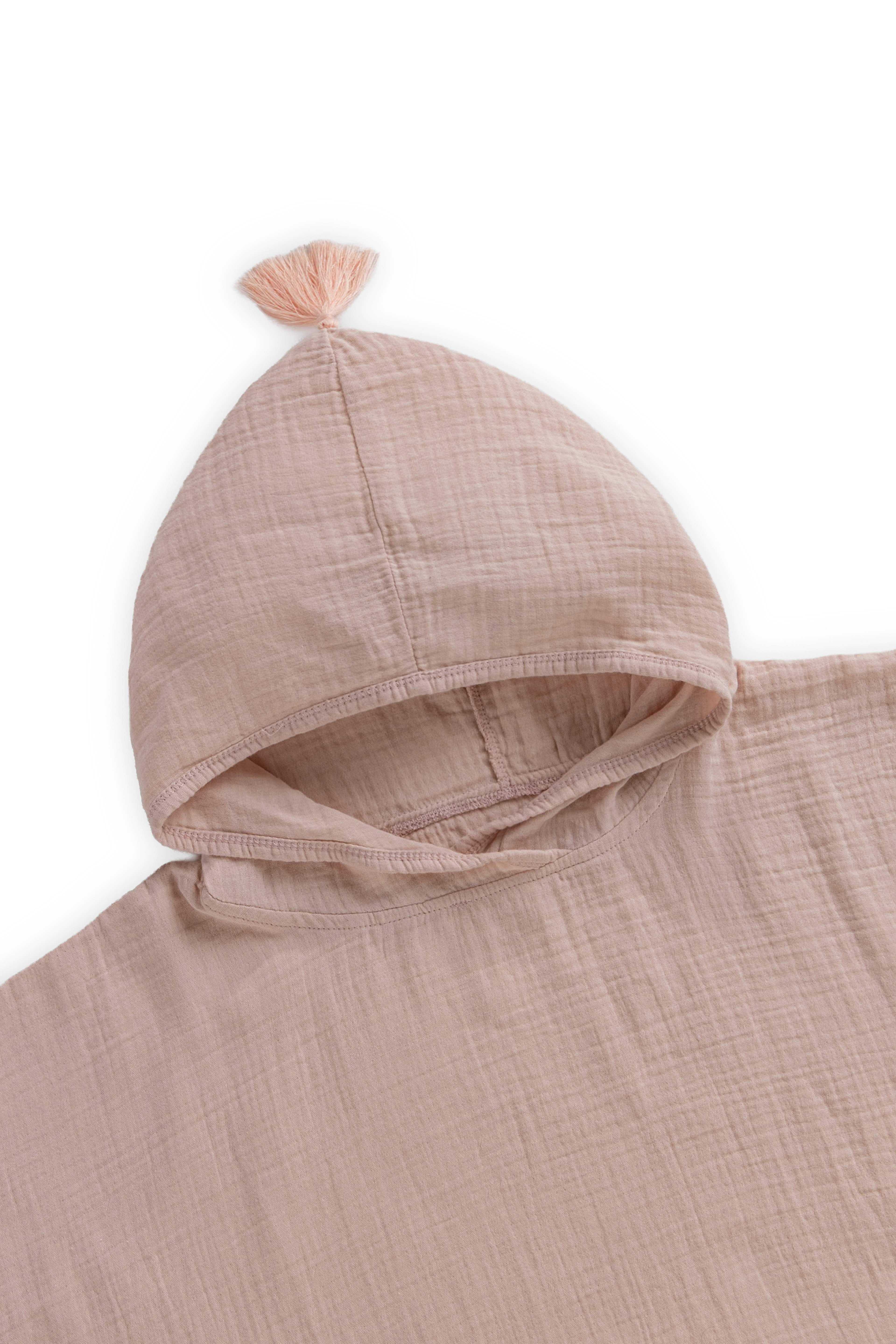 Muslin Poncho, från Minimoca, i färgen rosa. Klicka för att öppna bilden i stort format