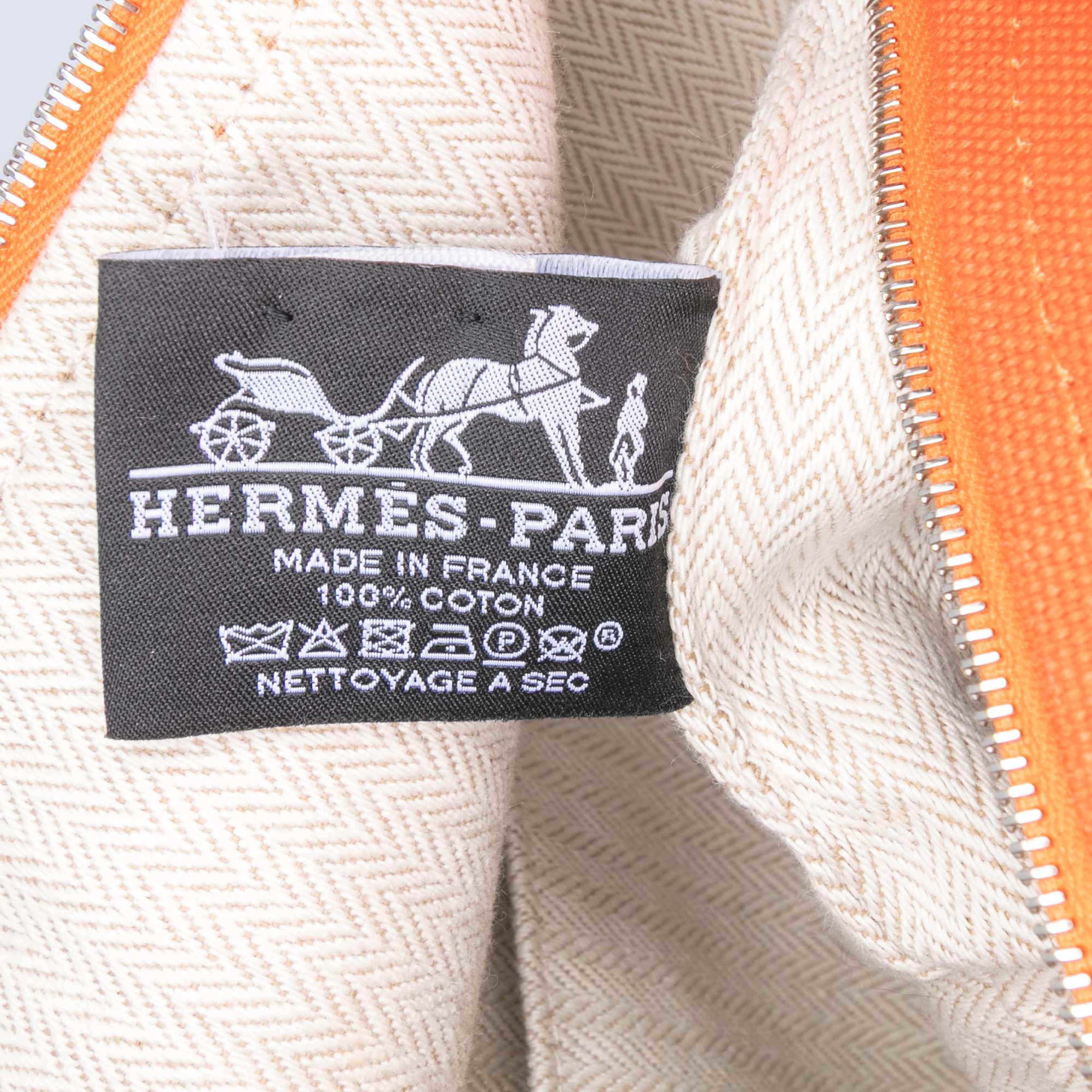 Hermès Large Toile Bride A Brac, från Luxclusif, i färgen dark orange. Klicka för att öppna bilden i stort format