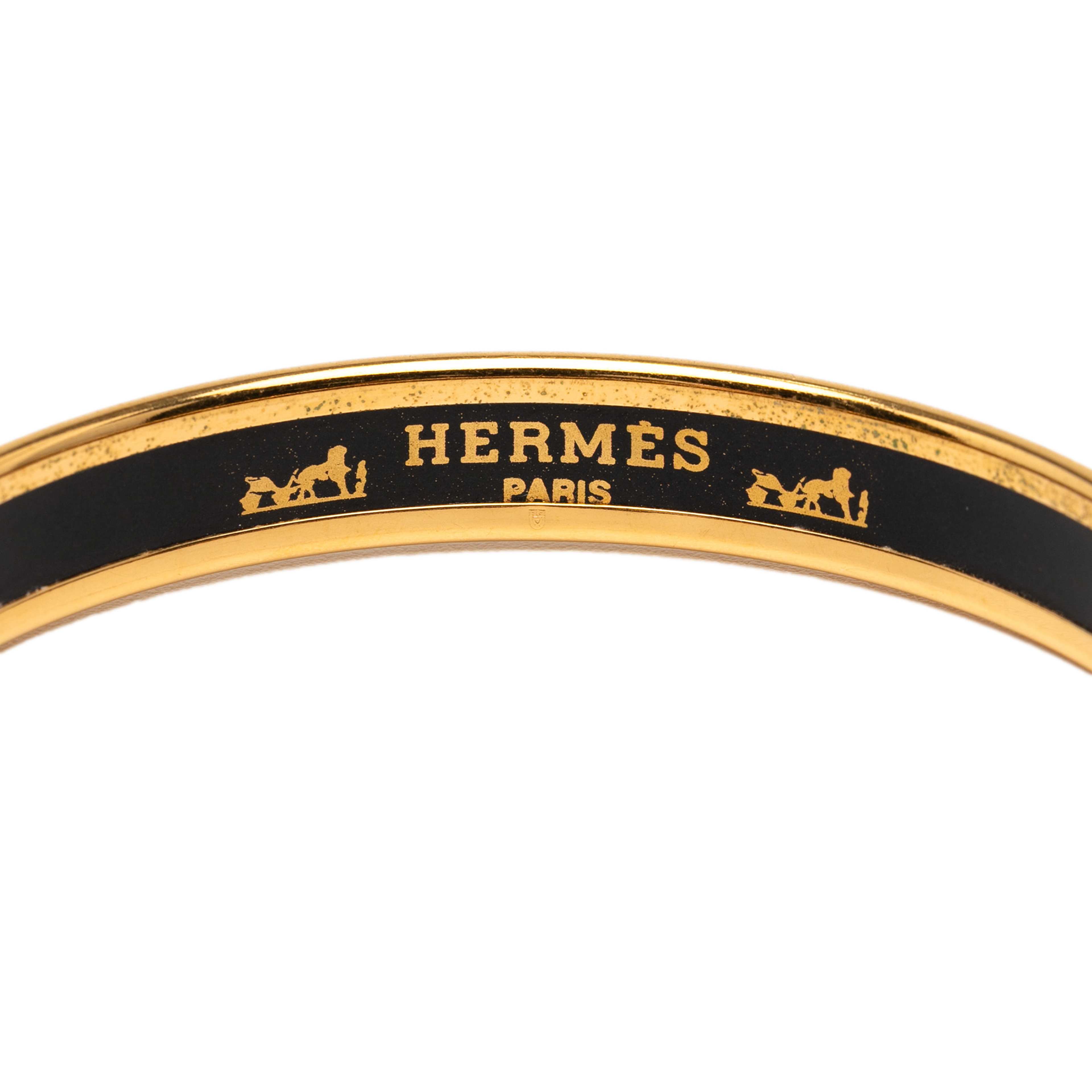 Hermès Narrow Printed Enamel Bangle 62, från Luxclusif, i färgen navy. Klicka för att öppna bilden i stort format