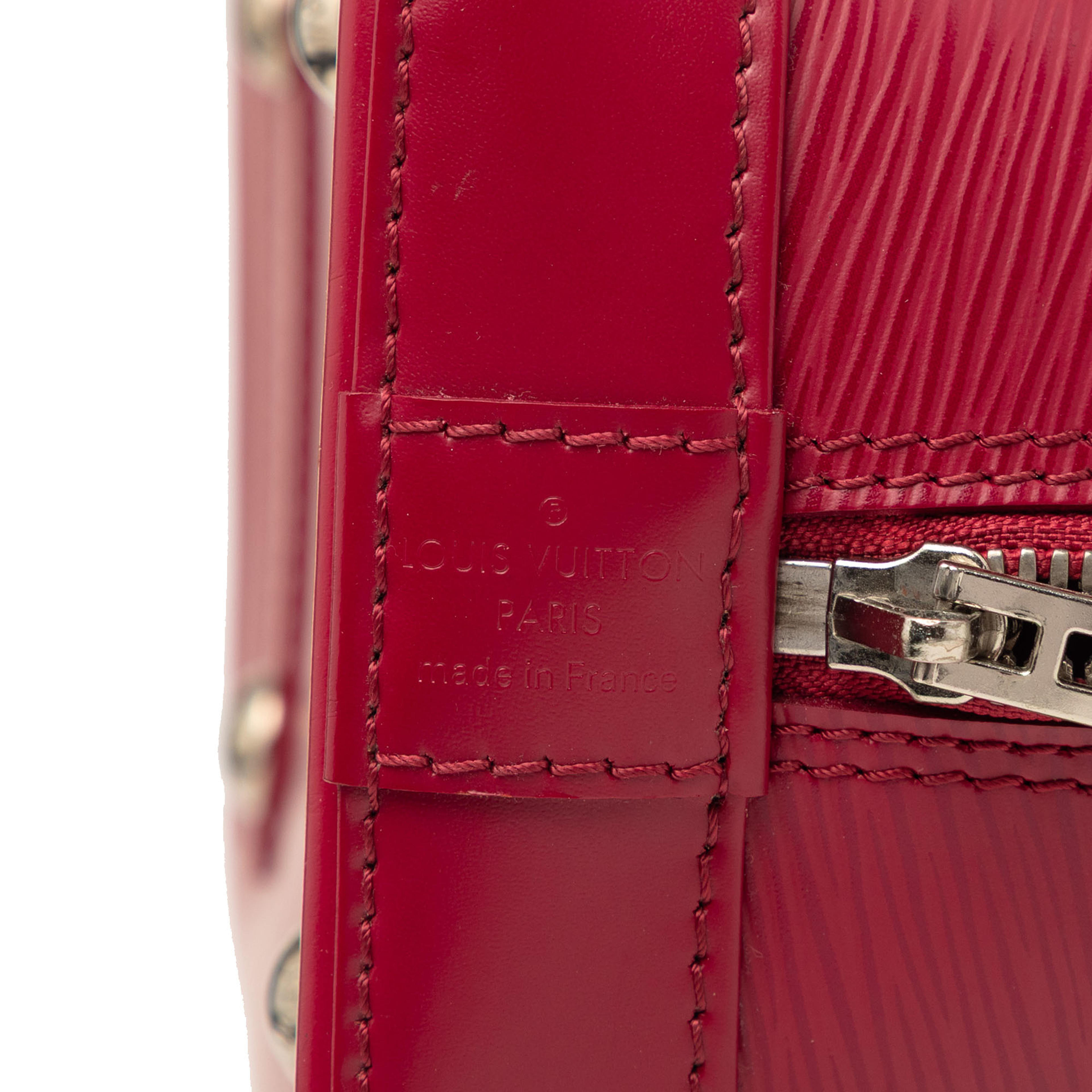 Louis Vuitton Epi Alma Pm, från Luxclusif, i färgen dark pink. Klicka för att öppna bilden i stort format