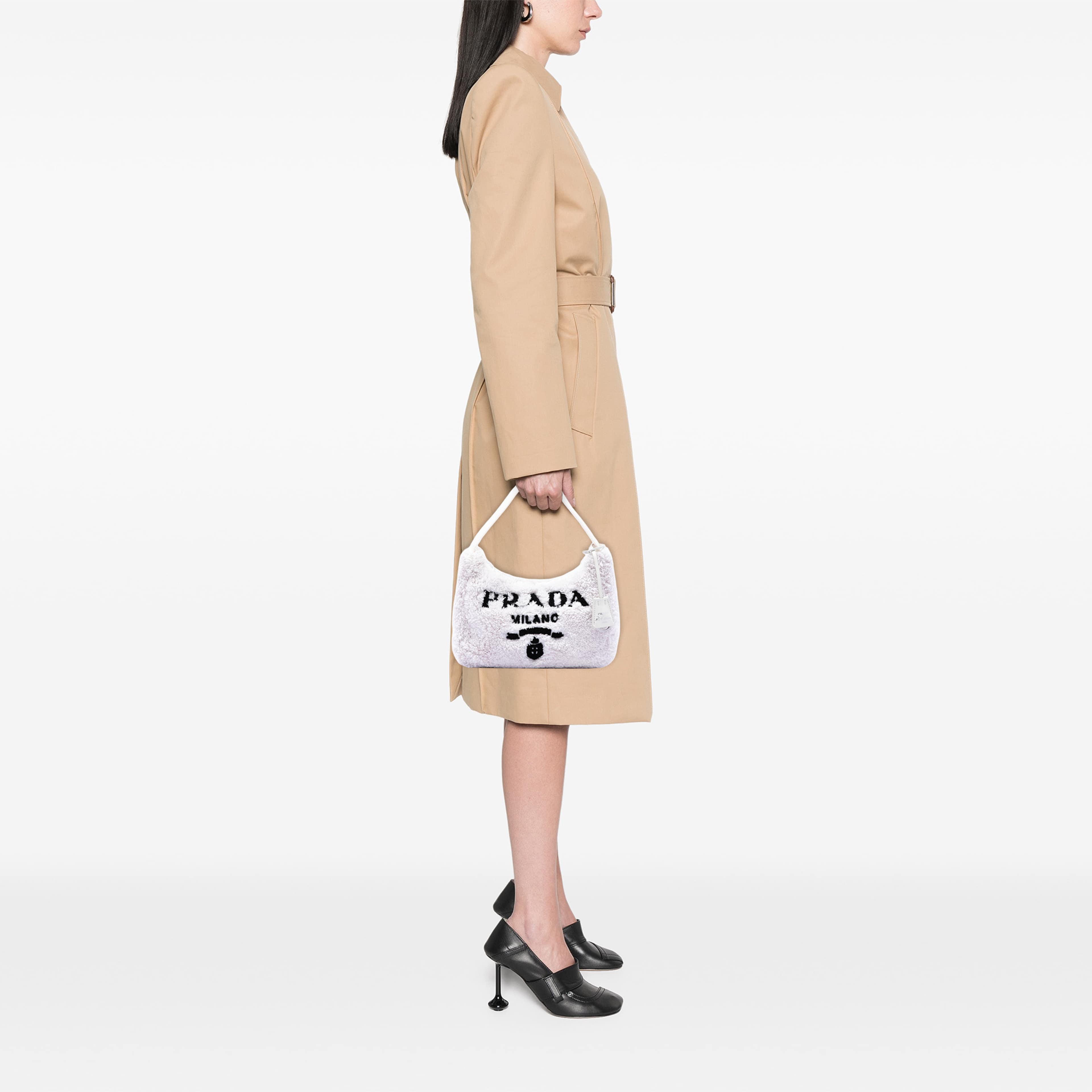 Prada Mini Terry Re Edition 2000 Shoulder Bag, från Luxclusif, i färgen vit. Klicka för att öppna bilden i stort format