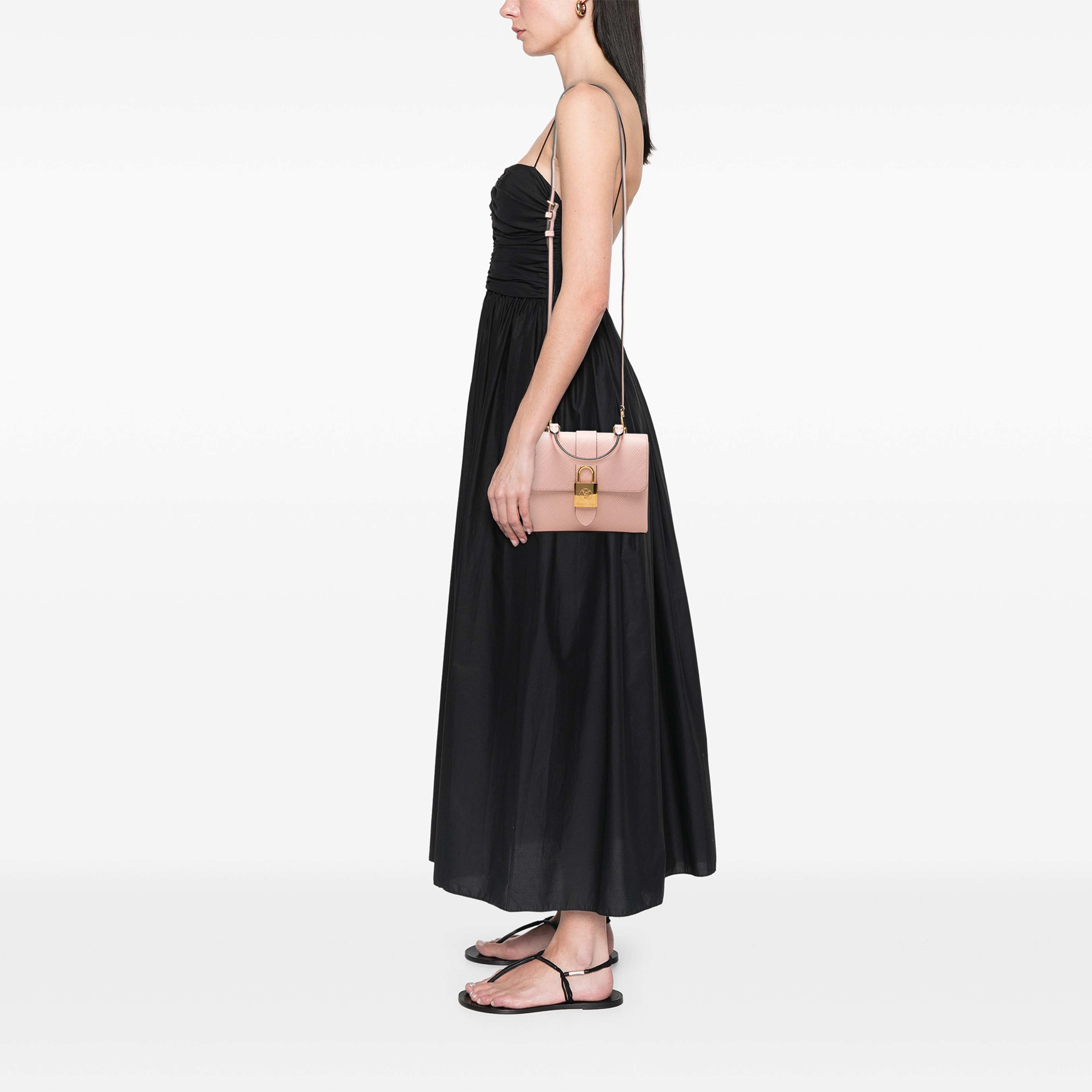 Louis Vuitton Epi Locky Bb, från Luxclusif, i färgen rosa. Klicka för att öppna bilden i stort format
