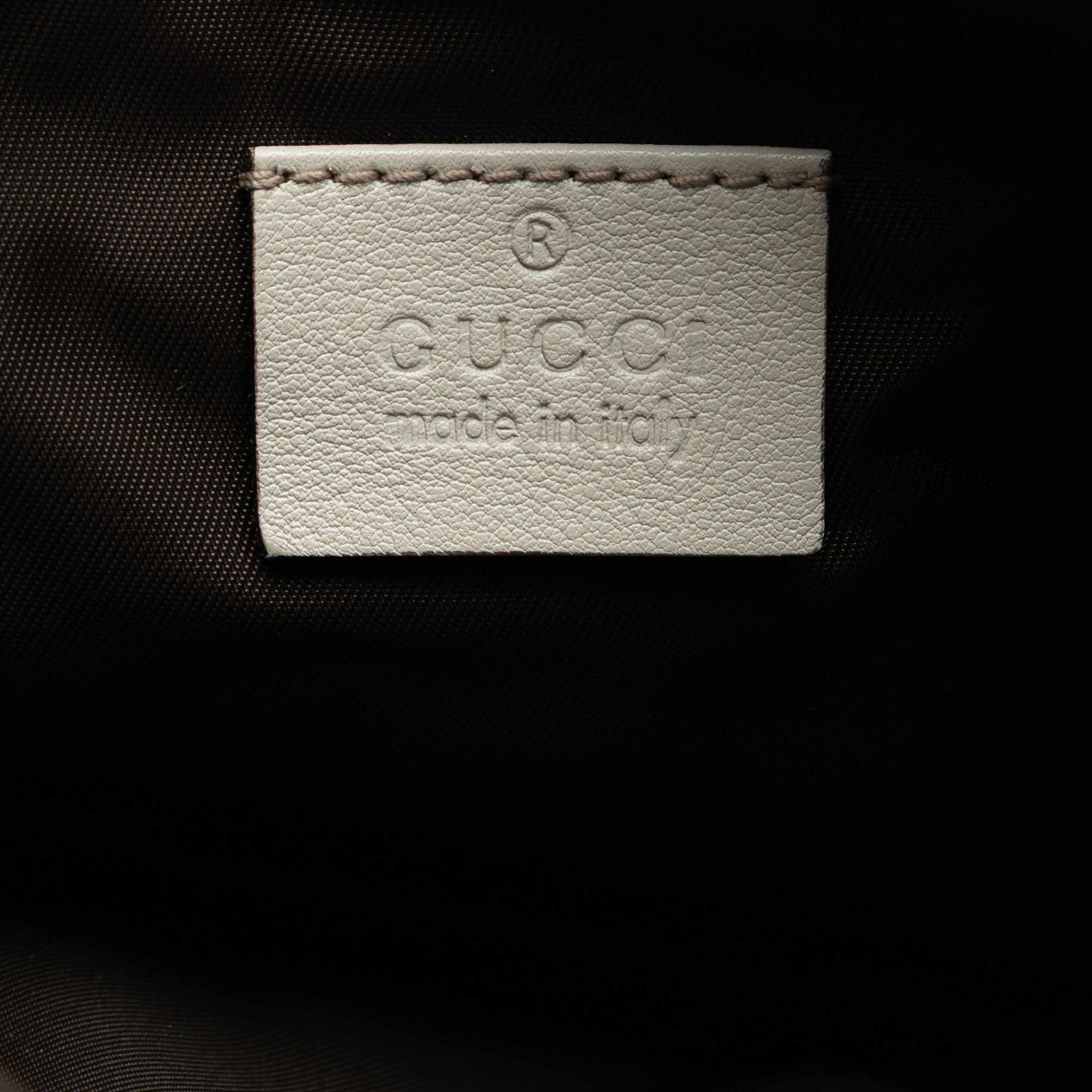Gucci Guccissima New Britt Wristlet Clutch, från Luxclusif, i färgen white. Klicka för att öppna bilden i stort format