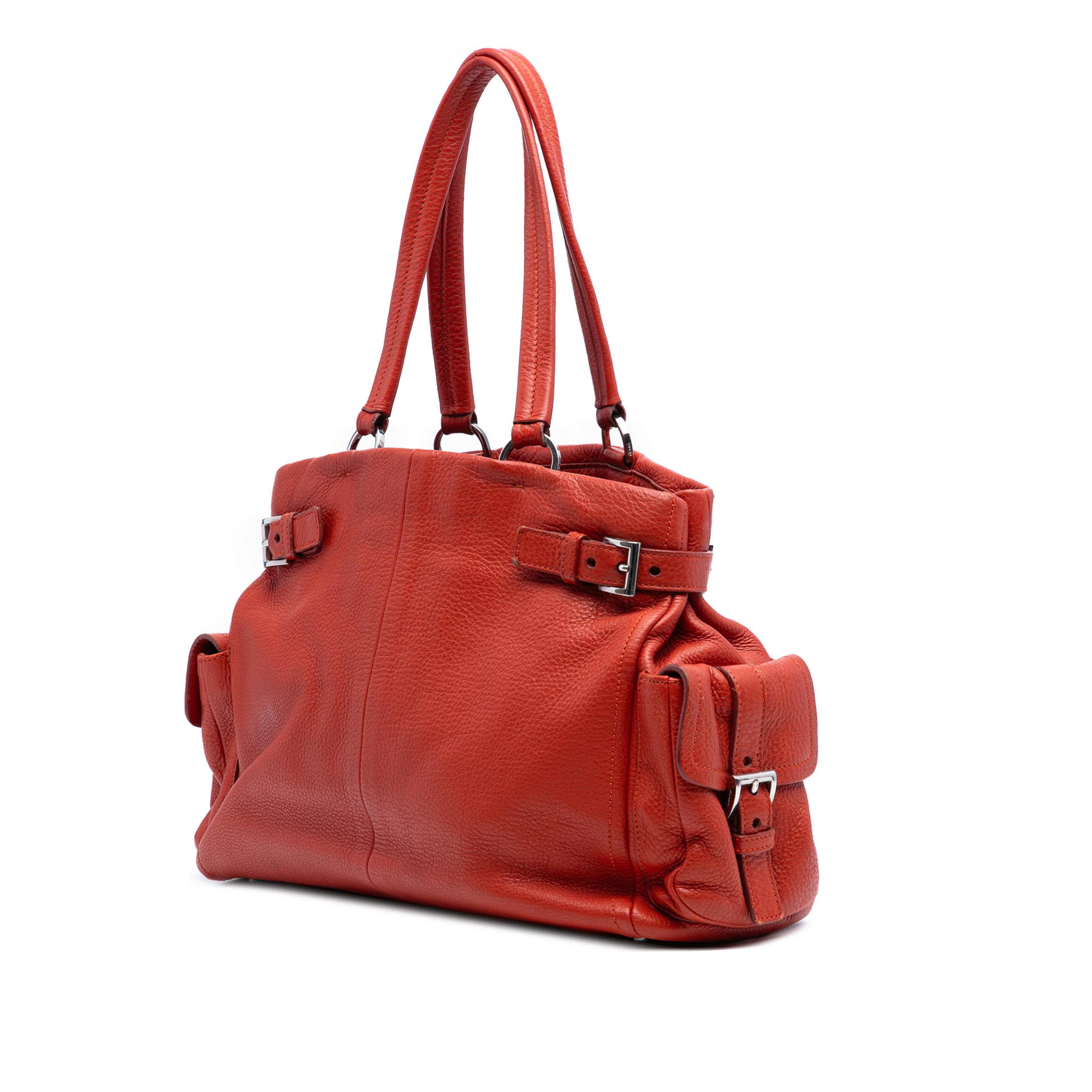 Prada Vitello Daino Side Pocket Tote, från Luxclusif, i färgen dark orange. Klicka för att öppna bilden i stort format