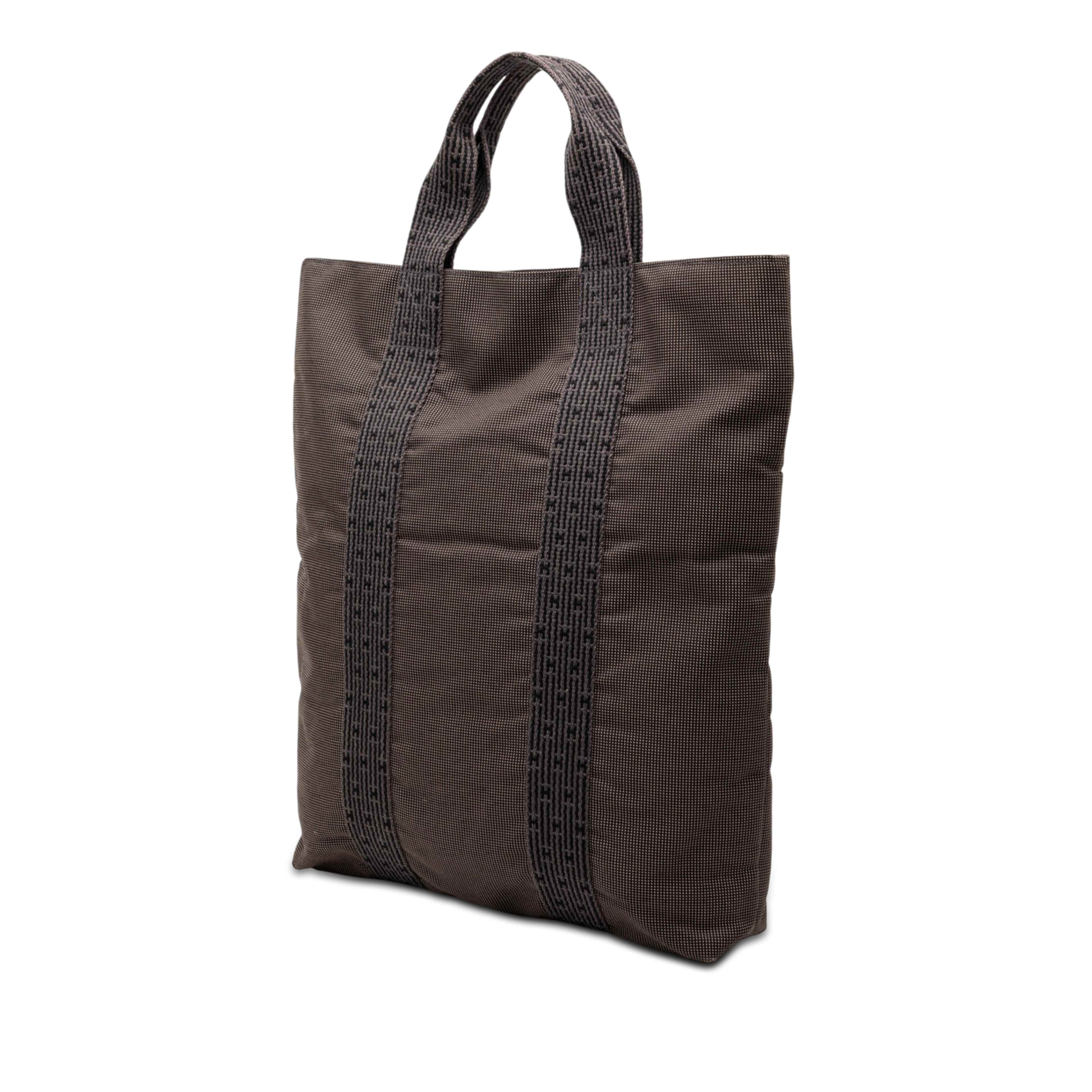 Hermès Canvas Herline Cabas, från Luxclusif, i färgen dark brown. Klicka för att öppna bilden i stort format