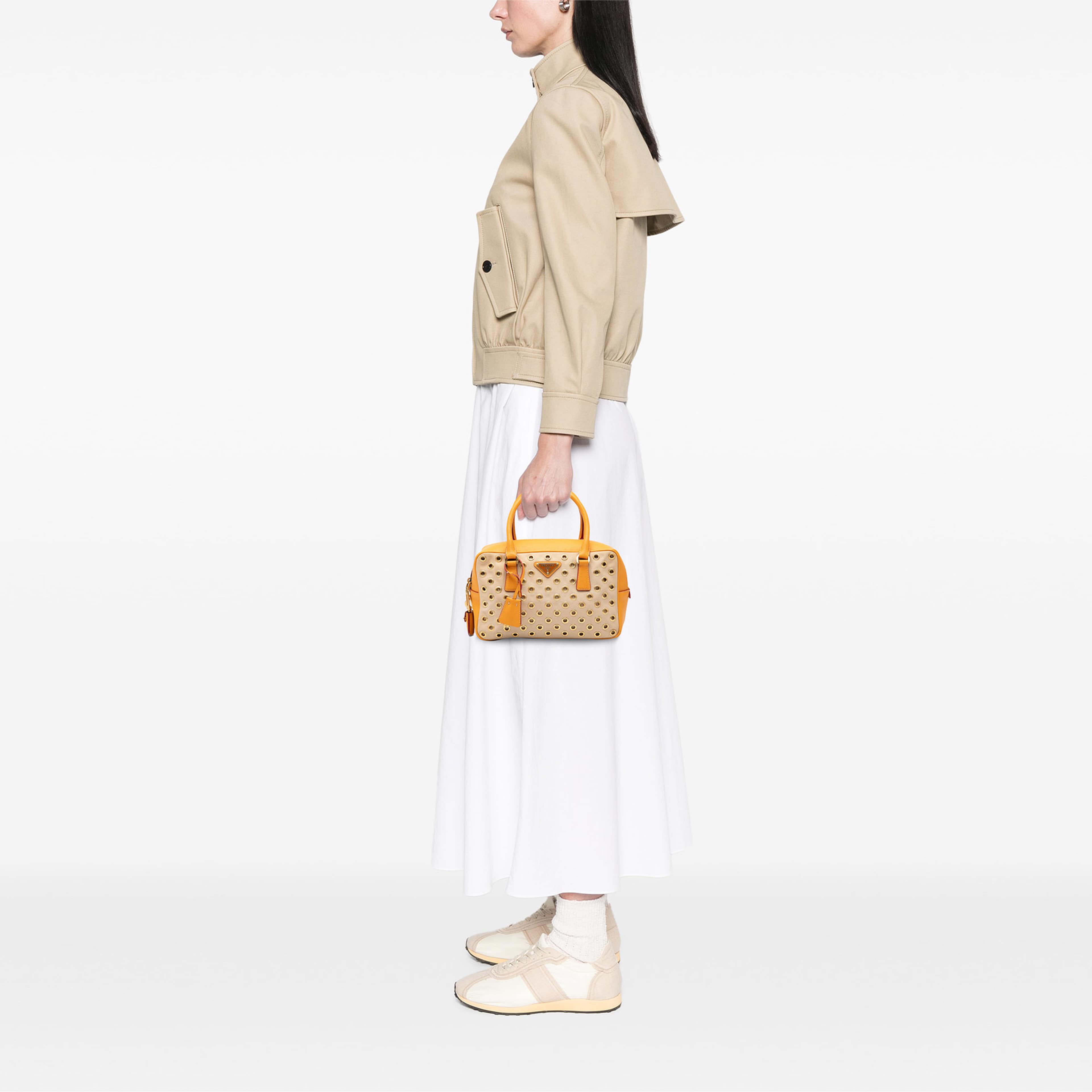 Prada Small Saffiano Trimmed Canvas Grommet Bauletto Bag, från Luxclusif, i färgen beige. Klicka för att öppna bilden i stort format
