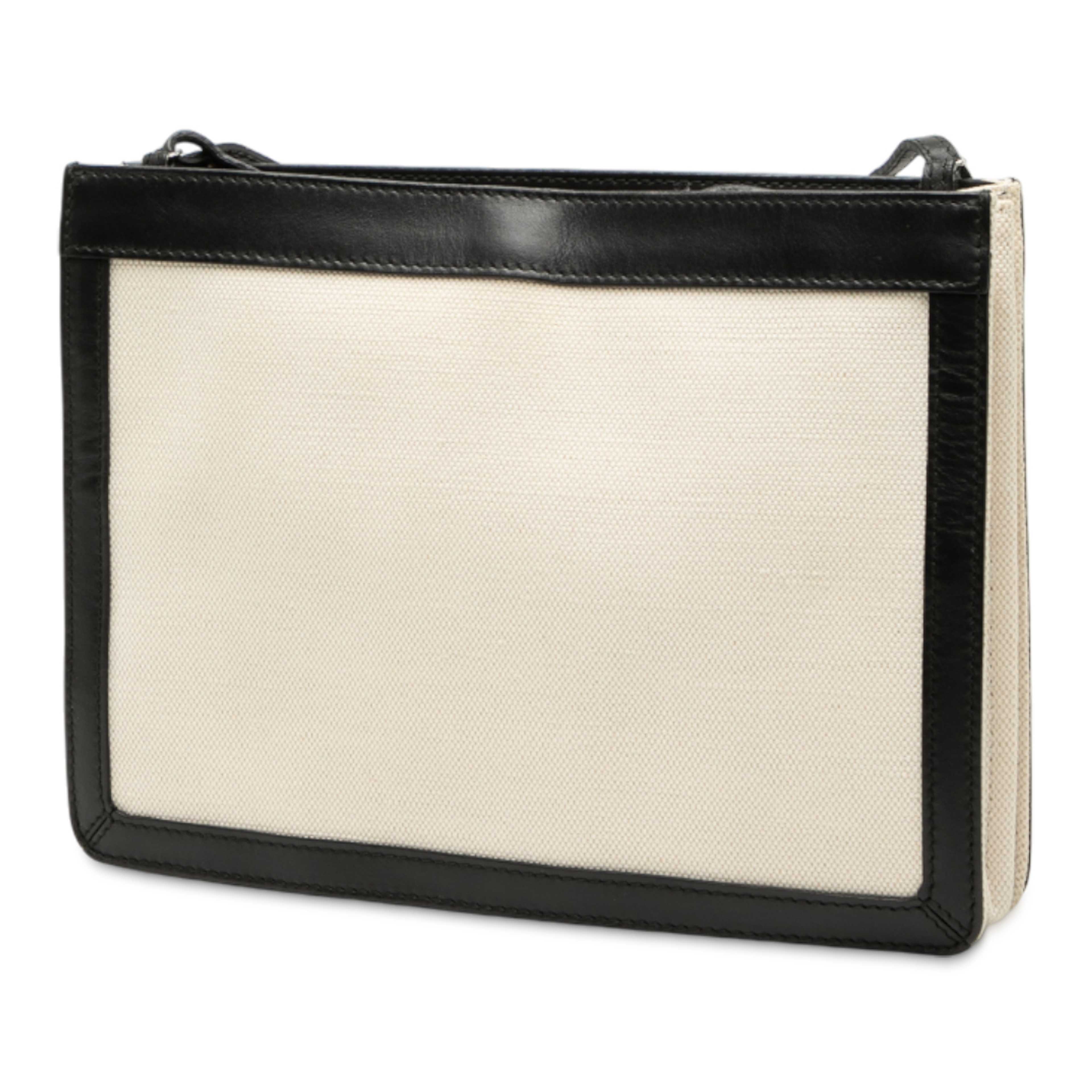 Balenciaga Canvas Navy Pochette Crossbody, från Luxclusif, i färgen light beige. Klicka för att öppna bilden i stort format