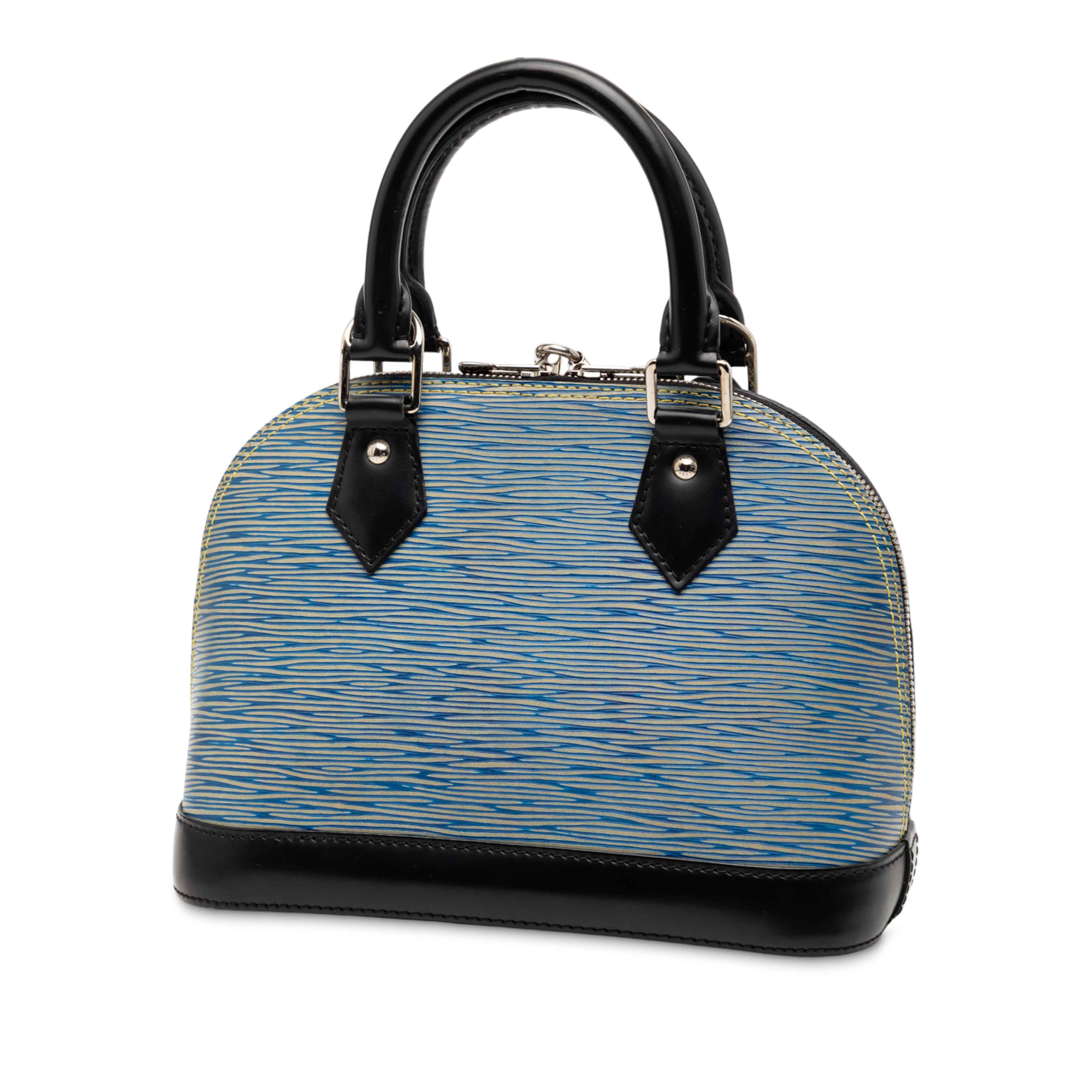 Louis Vuitton Epi Denim Alma Bb, från Luxclusif, i färgen blue. Klicka för att öppna bilden i stort format