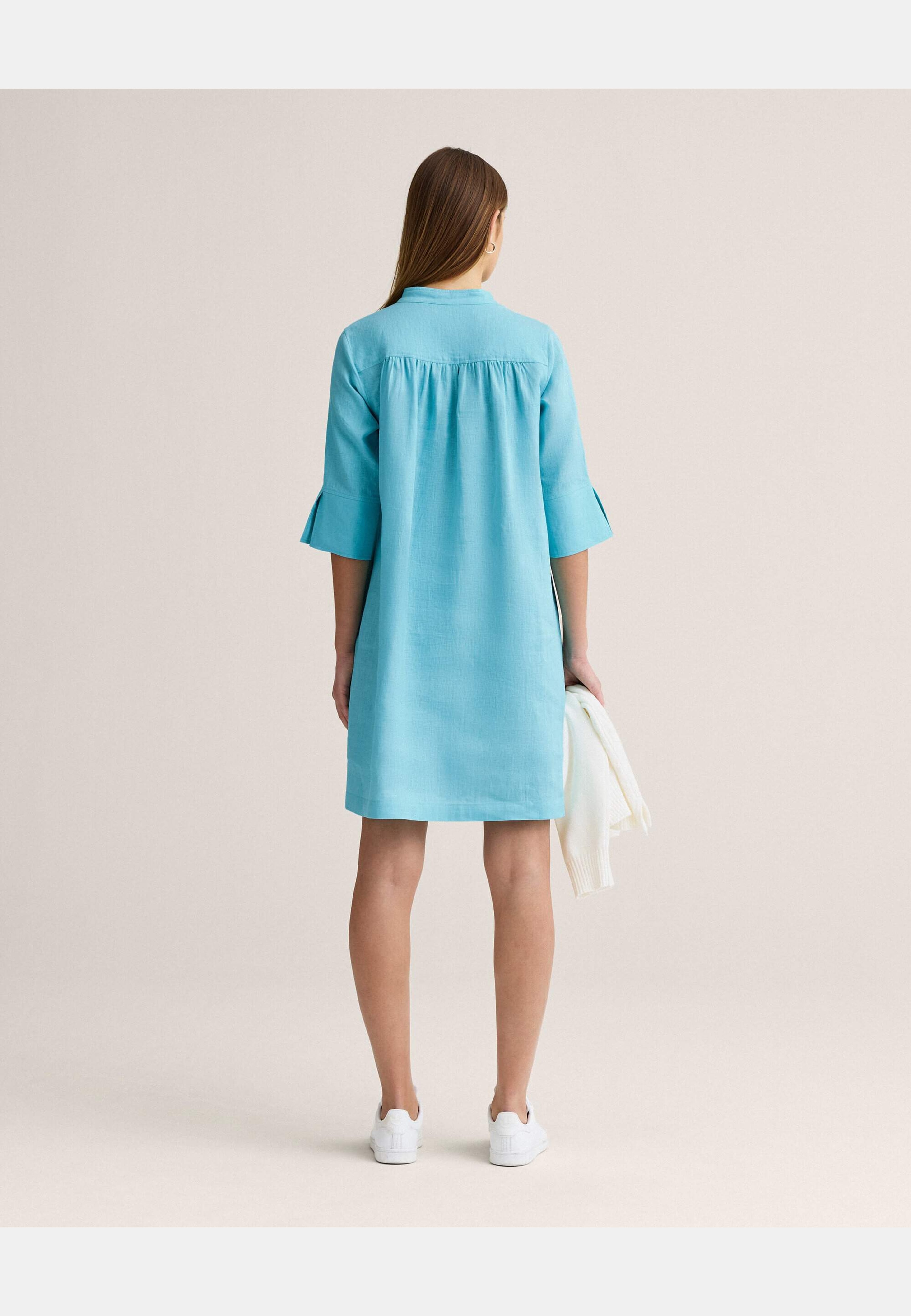 Thea Linen Dress, från Newhouse, i färgen turkos. Klicka för att öppna bilden i stort format