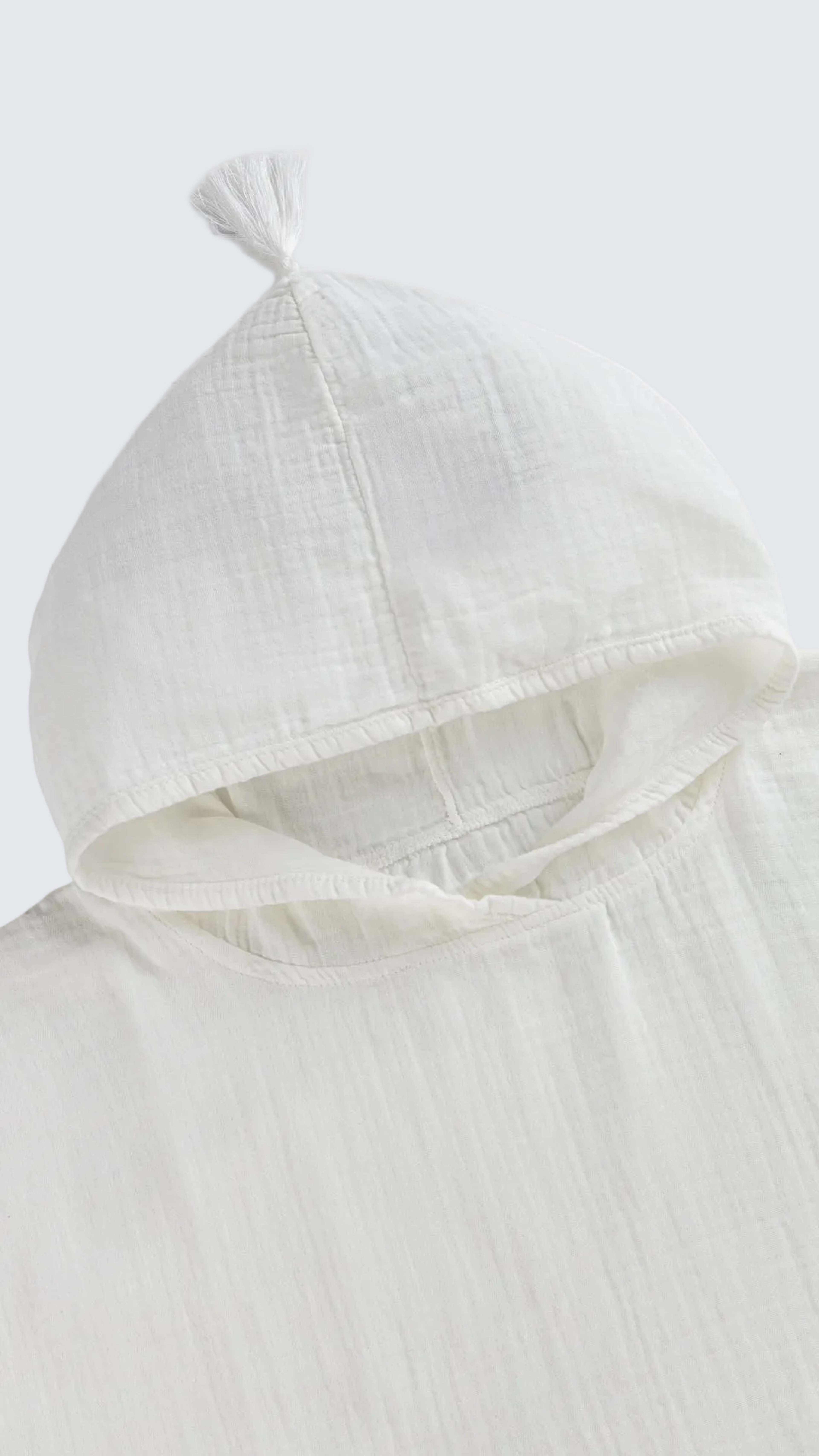 Muslin Poncho, från Minimoca, i färgen ecru. Klicka för att öppna bilden i stort format