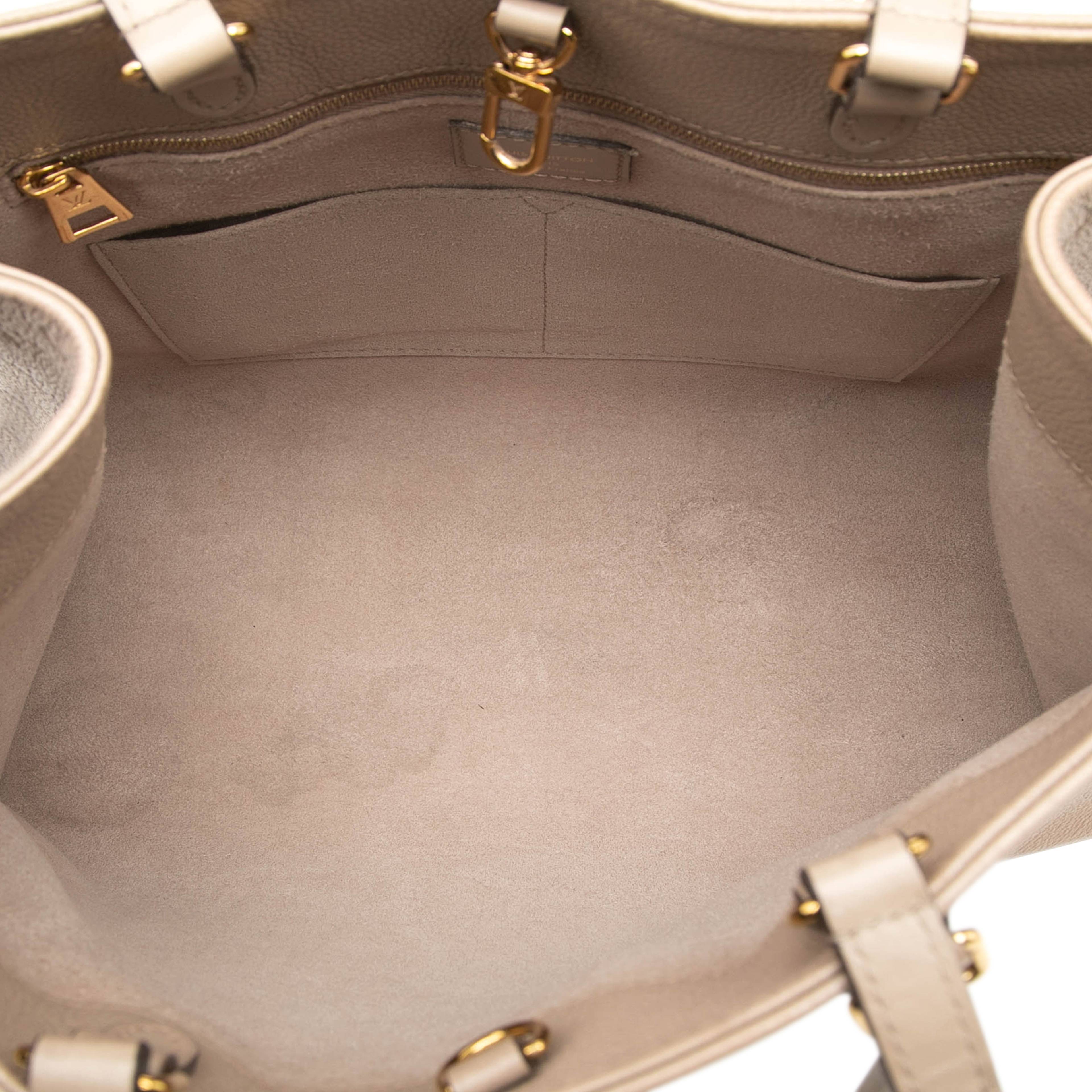 Louis Vuitton Monogram Empreinte Onthego Mm, från Luxclusif, i färgen beige. Klicka för att öppna bilden i stort format