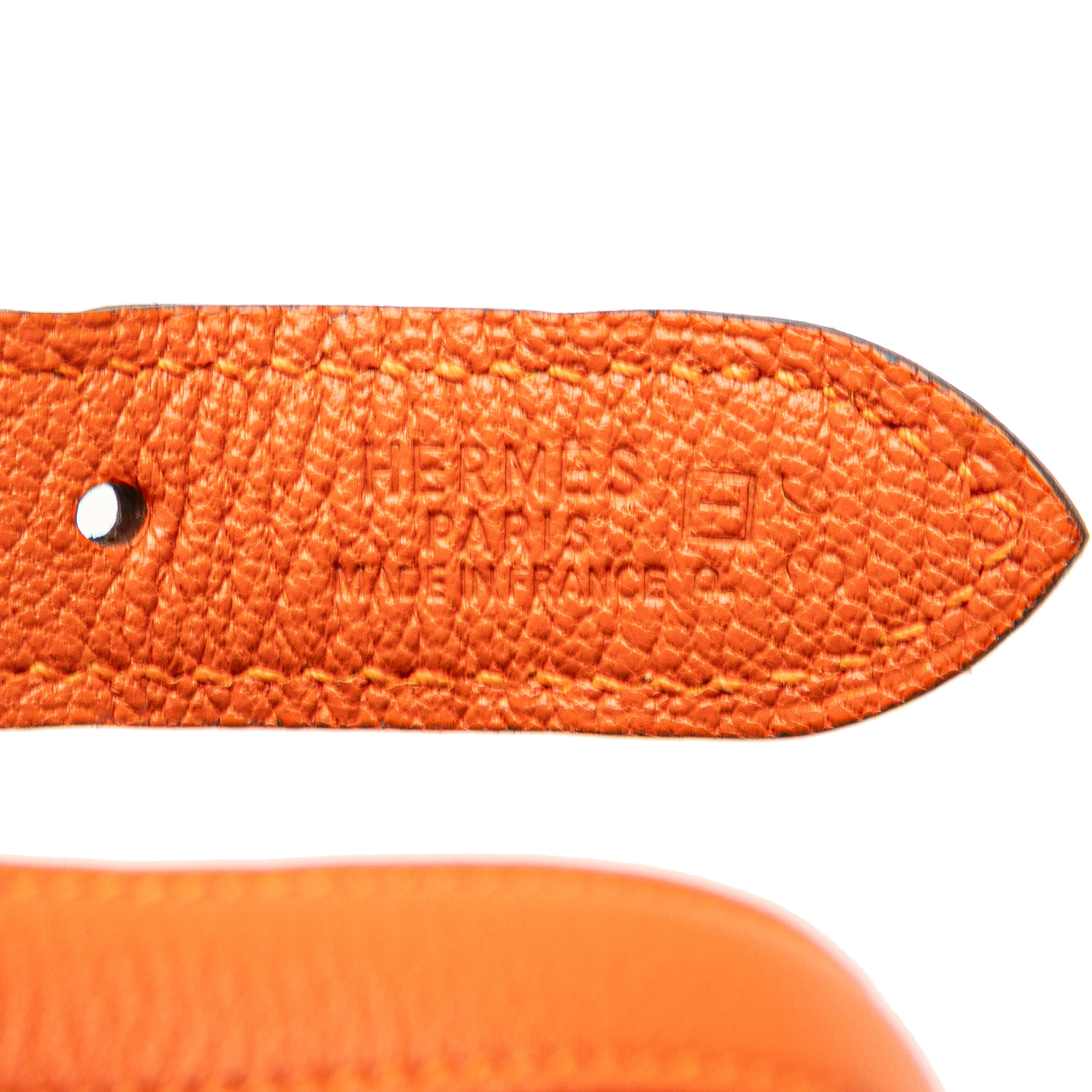 Hermès Clemence Trim Duo 24, från Luxclusif, i färgen orange. Klicka för att öppna bilden i stort format