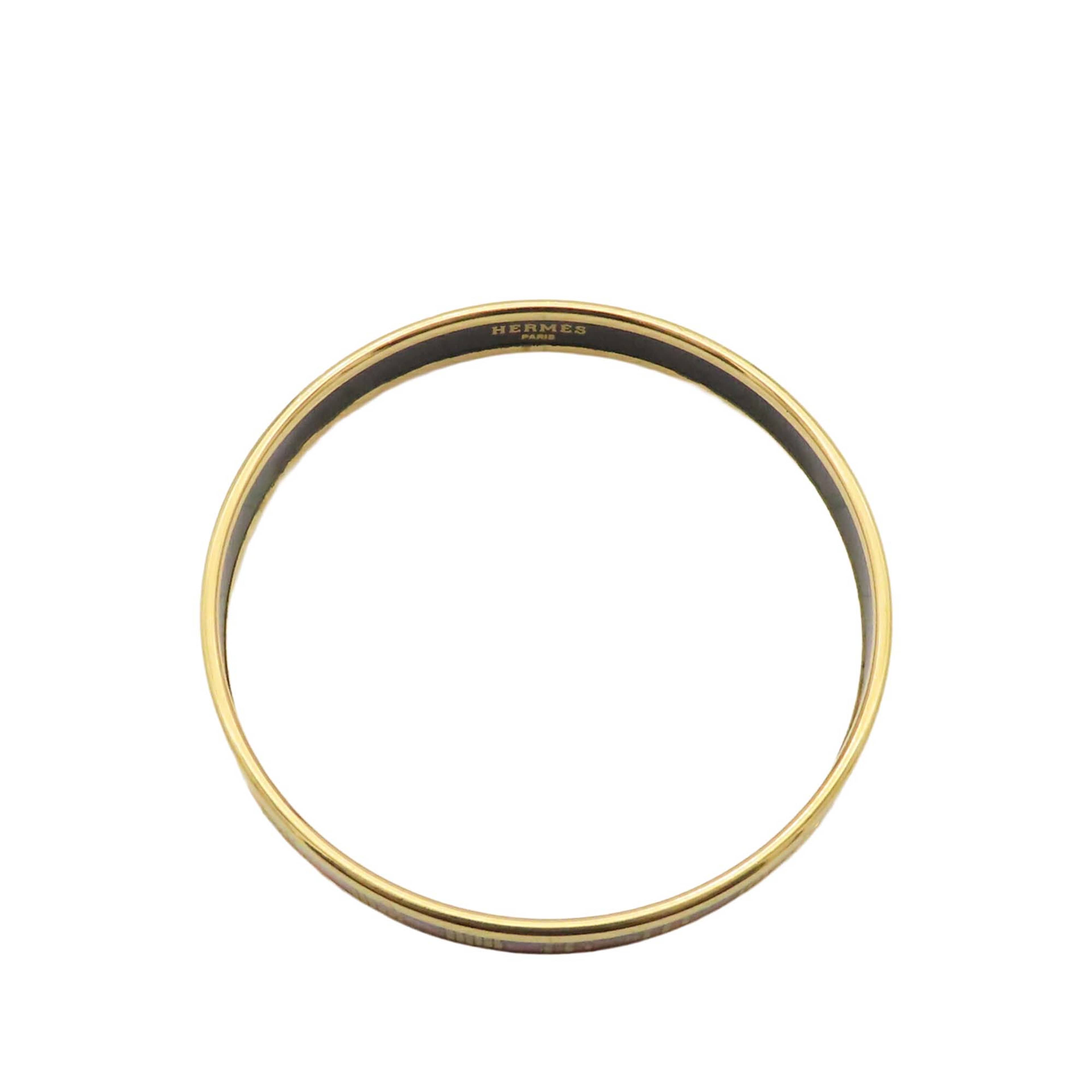 Hermès Narrow Emailles Enamel Bangle 62, från Luxclusif, i färgen gold. Klicka för att öppna bilden i stort format