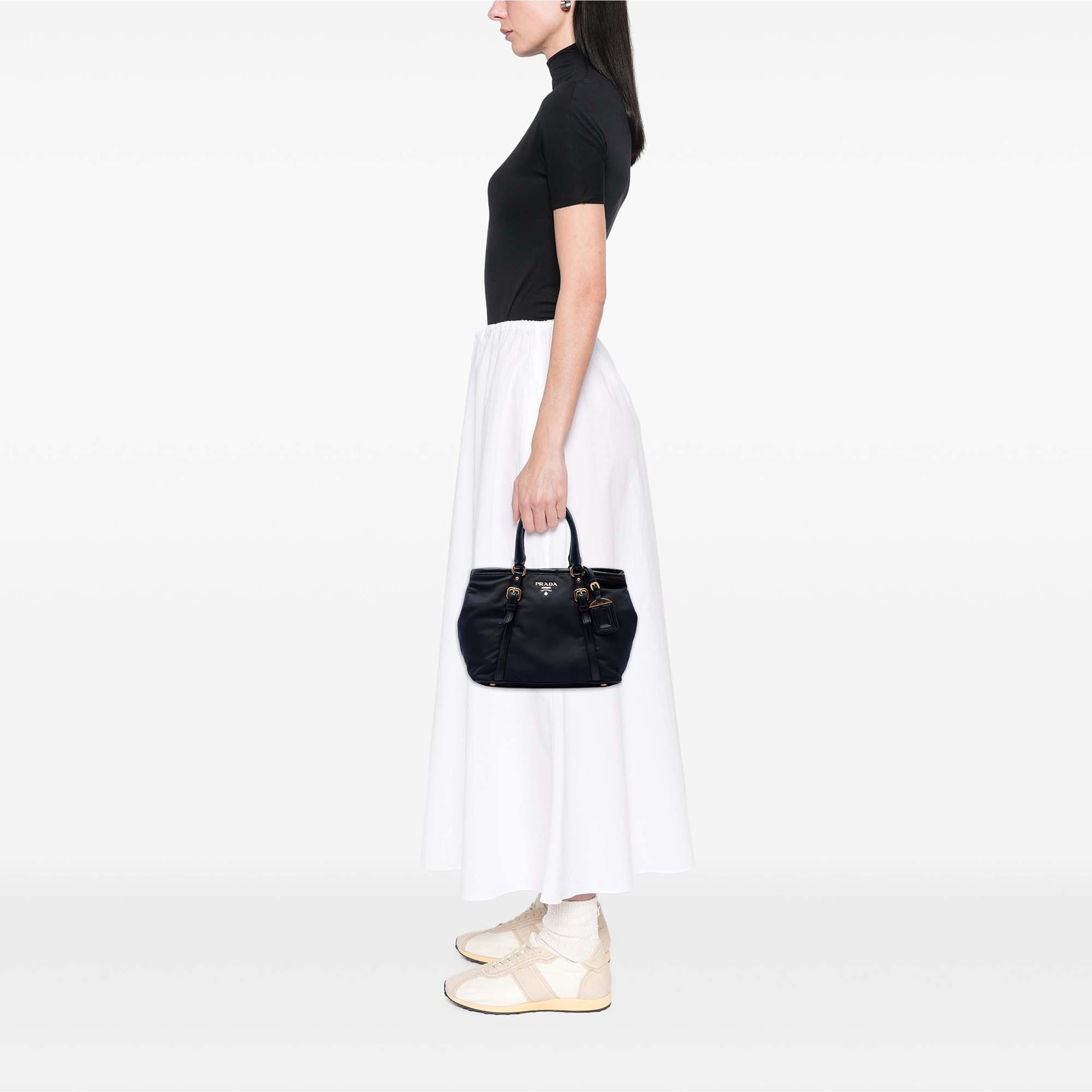 Prada Soft Calf Trimmed Tessuto Satchel, från Luxclusif, i färgen svart. Klicka för att öppna bilden i stort format