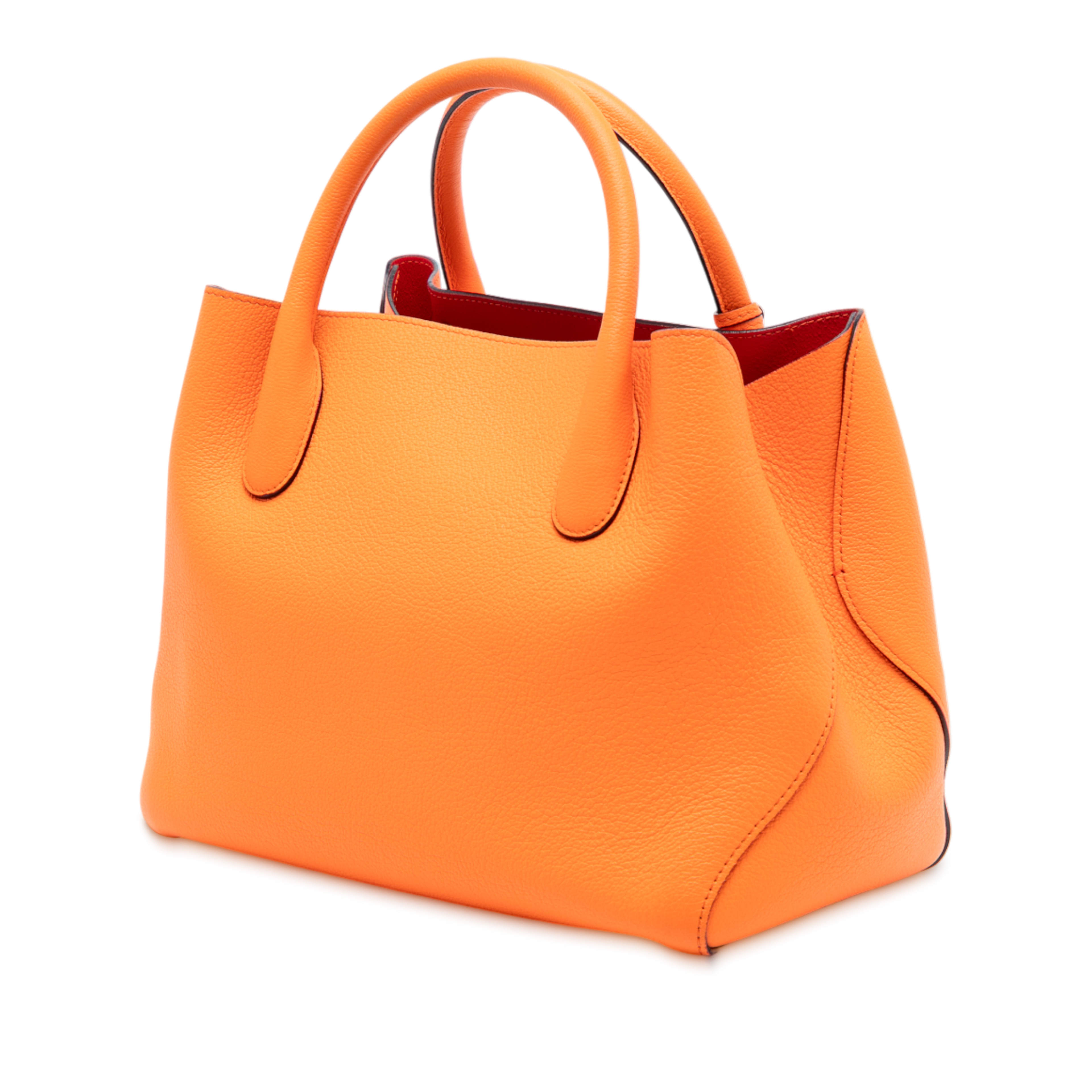 Dior Small Supple Grained Calfskin Open Bar Tote, från Luxclusif, i färgen orange. Klicka för att öppna bilden i stort format