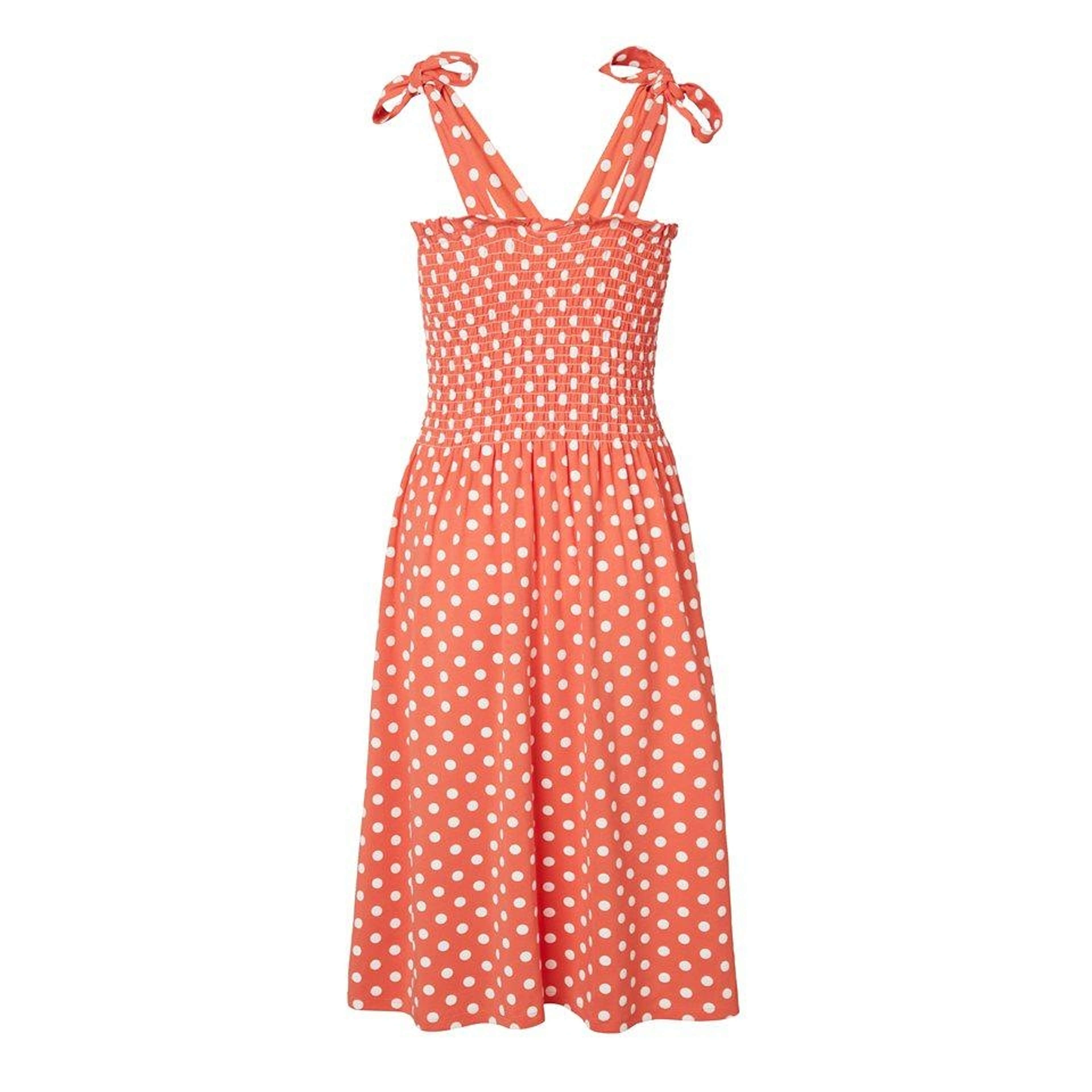 Prickig Solklänning Med Smock - Nicky Dot Coral, från Jumperfabriken, i färgen coral. Klicka för att öppna bilden i stort format