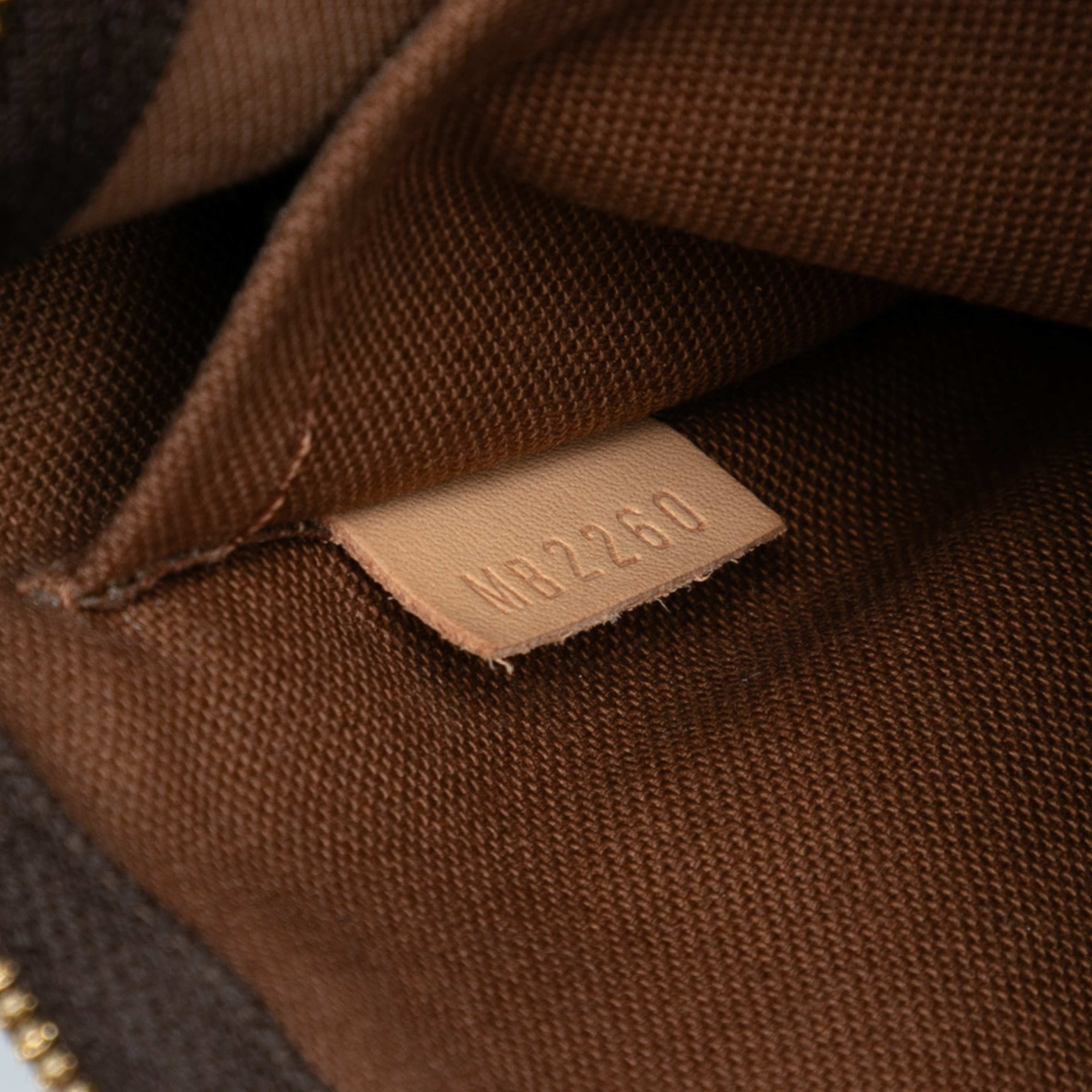 Louis Vuitton Monogram Multi Pochette Accessoires, från Luxclusif, i färgen brun. Klicka för att öppna bilden i stort format