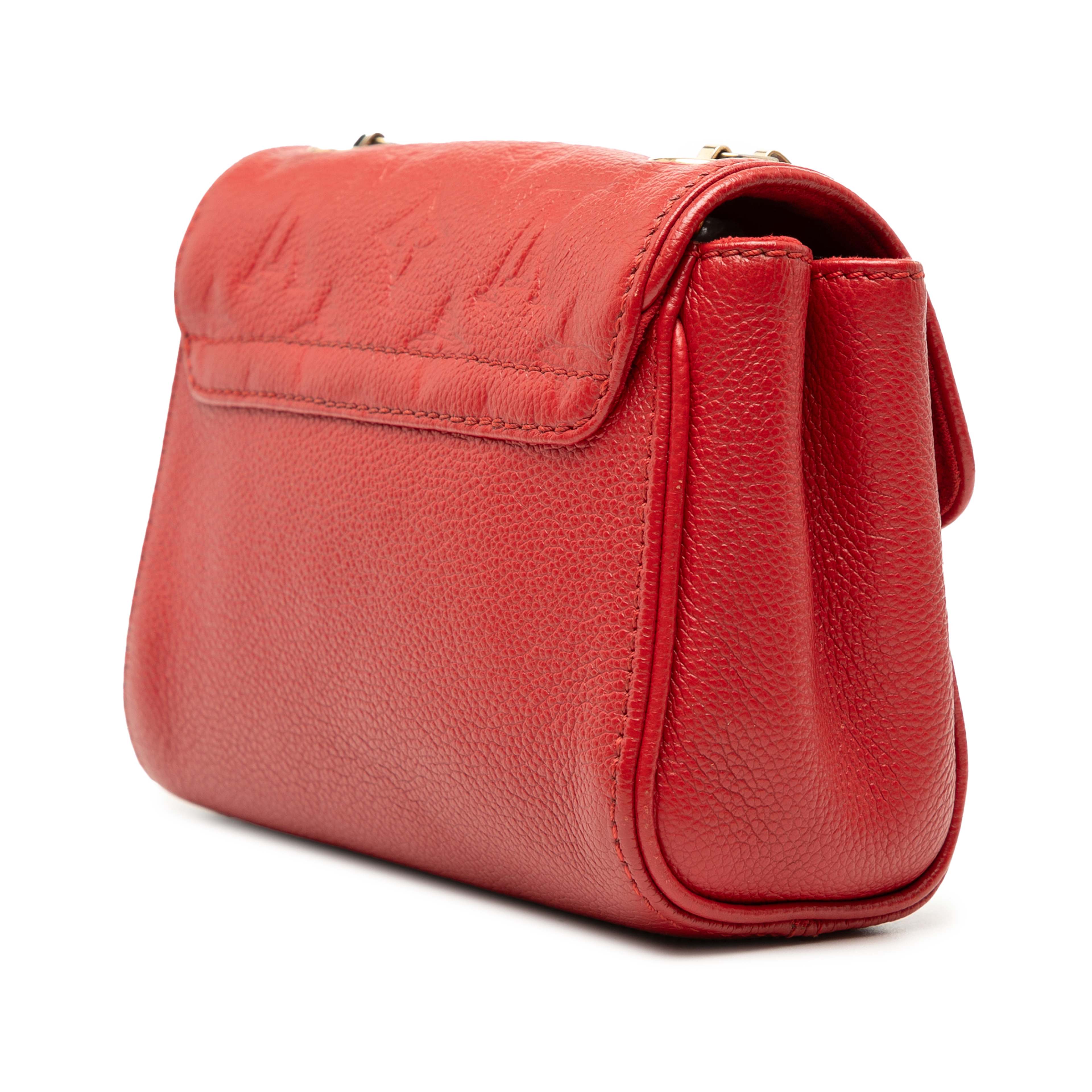 Louis Vuitton Monogram Empreinte Saint Germain Bb, från Luxclusif, i färgen röd. Klicka för att öppna bilden i stort format
