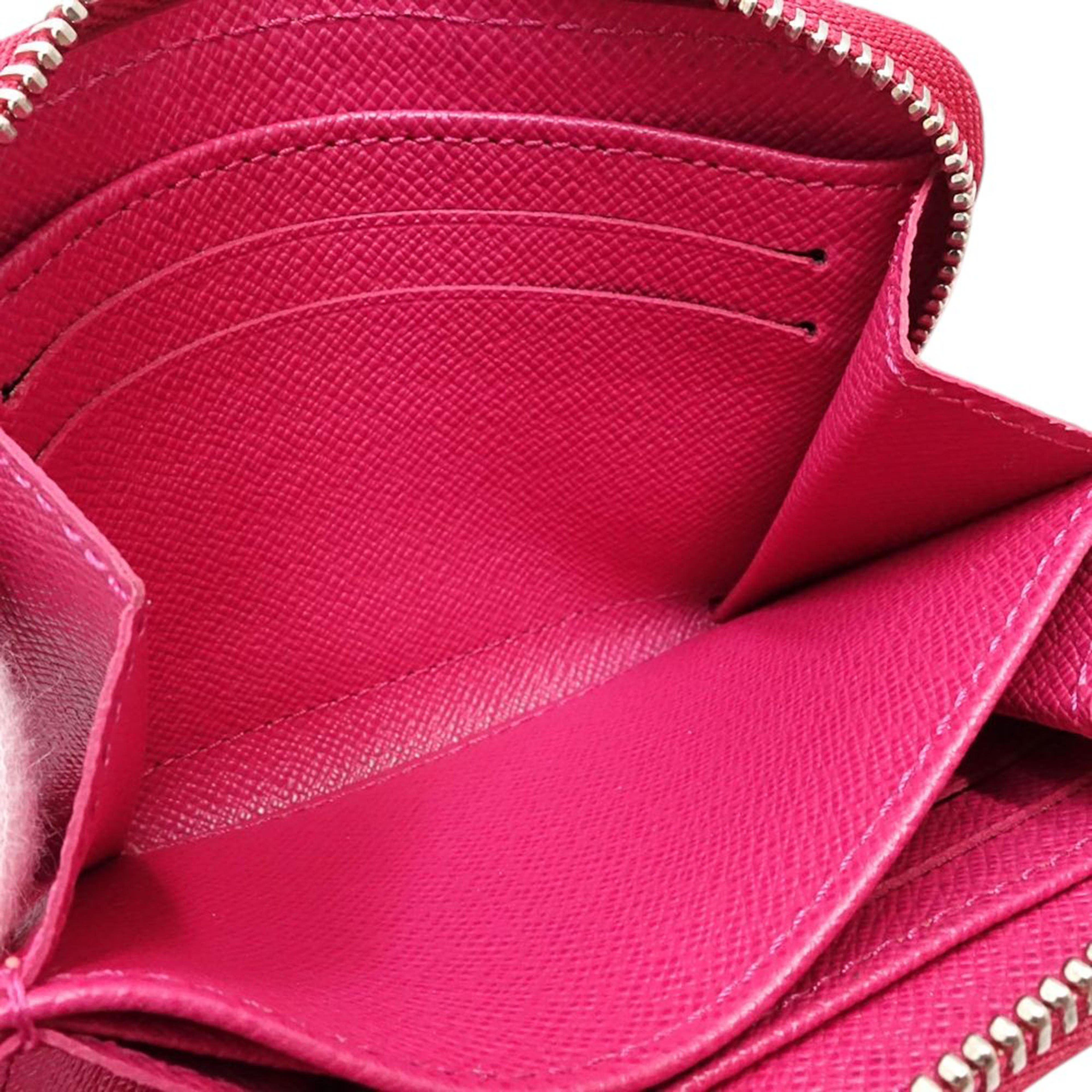 Louis Vuitton Epi Zippy Coin Purse, från Luxclusif, i färgen hot pink. Klicka för att öppna bilden i stort format