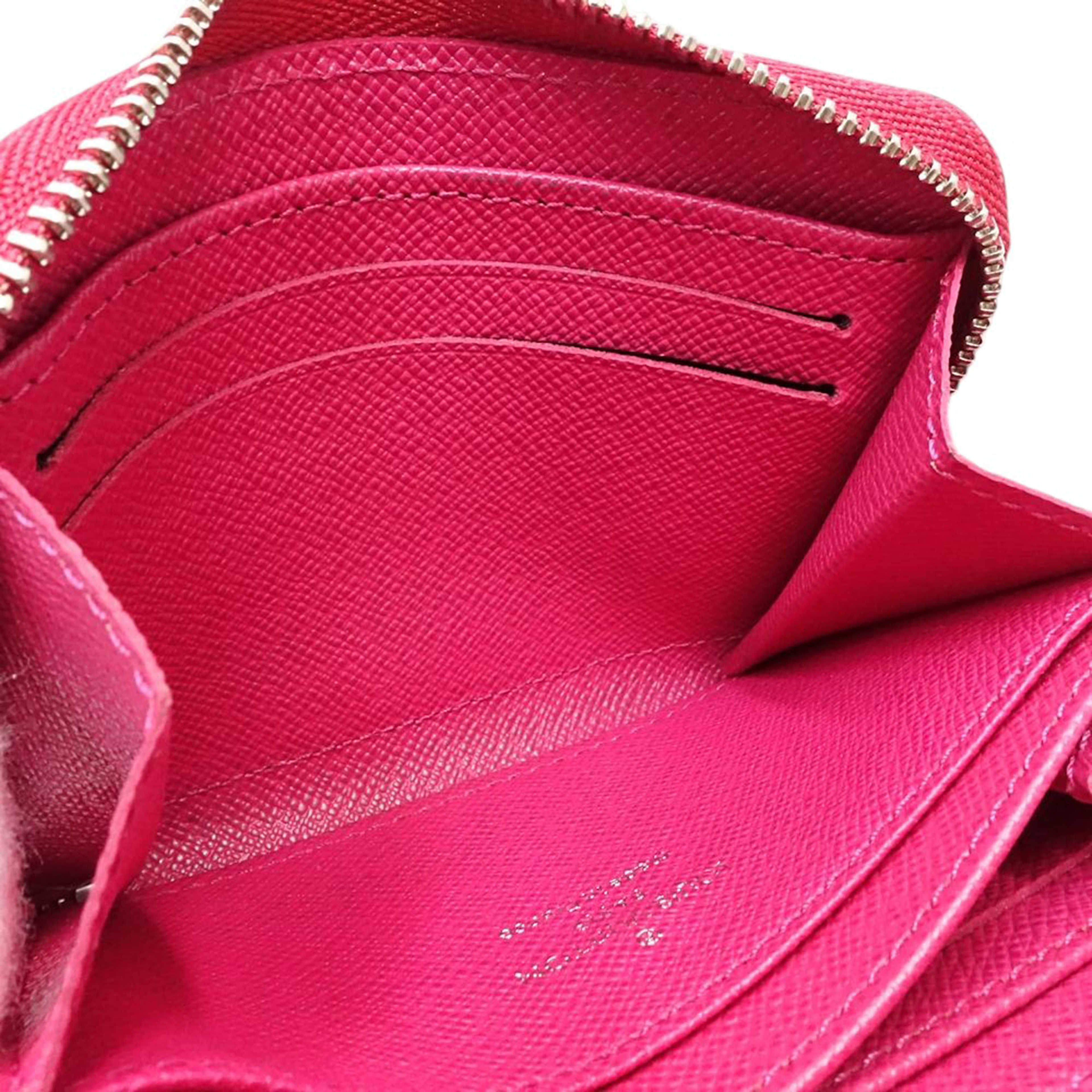 Louis Vuitton Epi Zippy Coin Purse, från Luxclusif, i färgen hot pink. Klicka för att öppna bilden i stort format