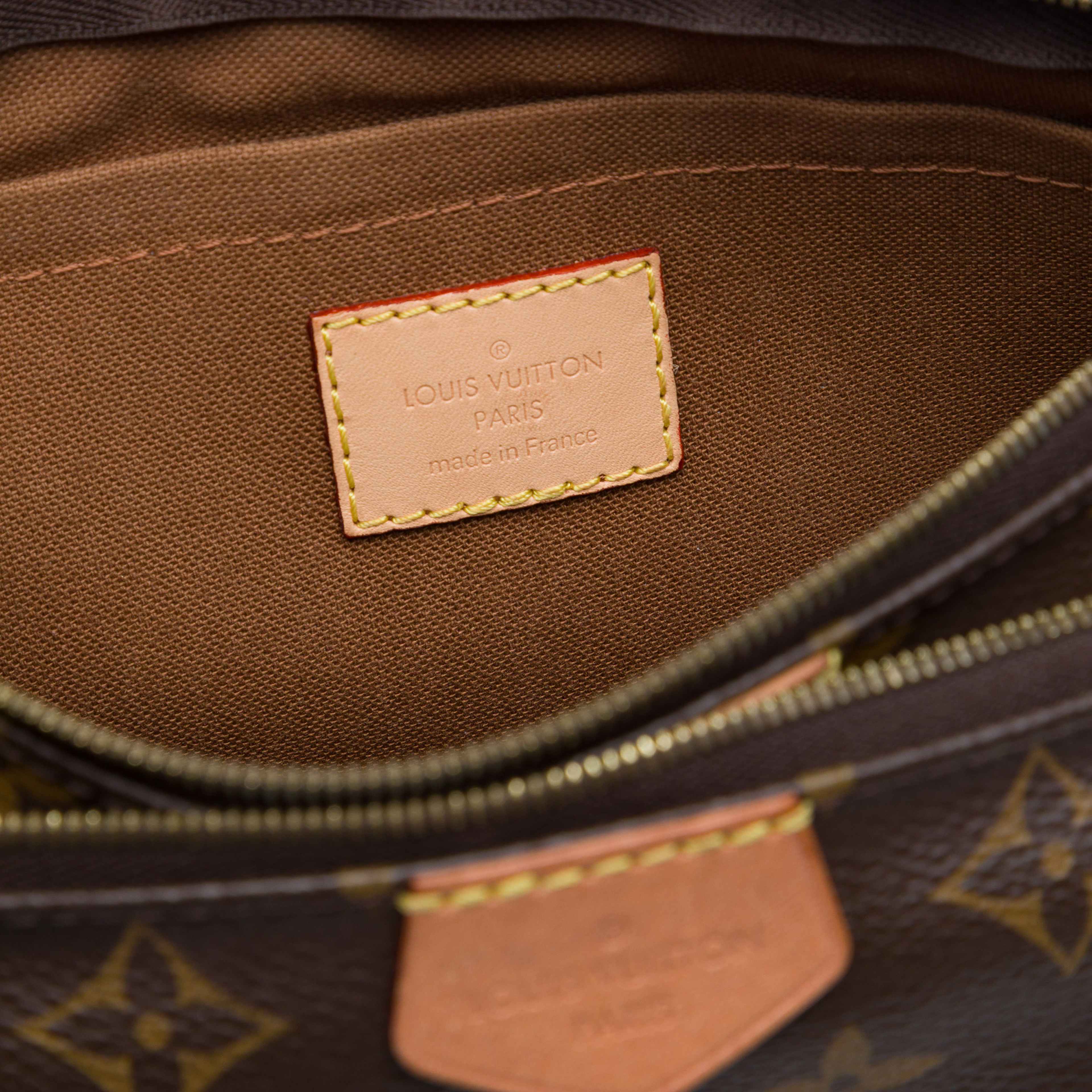 Louis Vuitton Monogram Multi Pochette Accessoires, från Luxclusif, i färgen brun. Klicka för att öppna bilden i stort format
