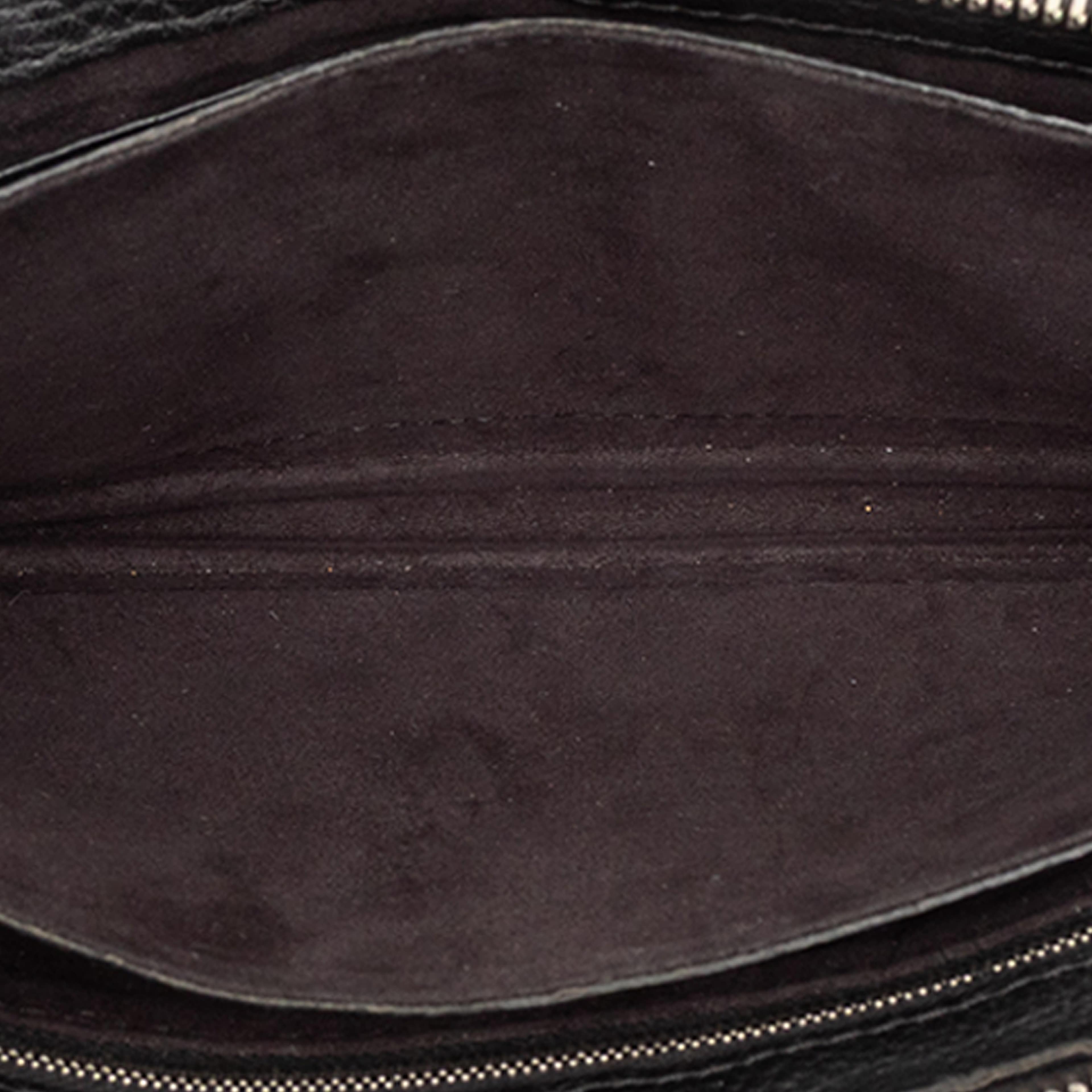 Fendi Leather Selleria Monster Clutch, från Luxclusif, i färgen black. Klicka för att öppna bilden i stort format