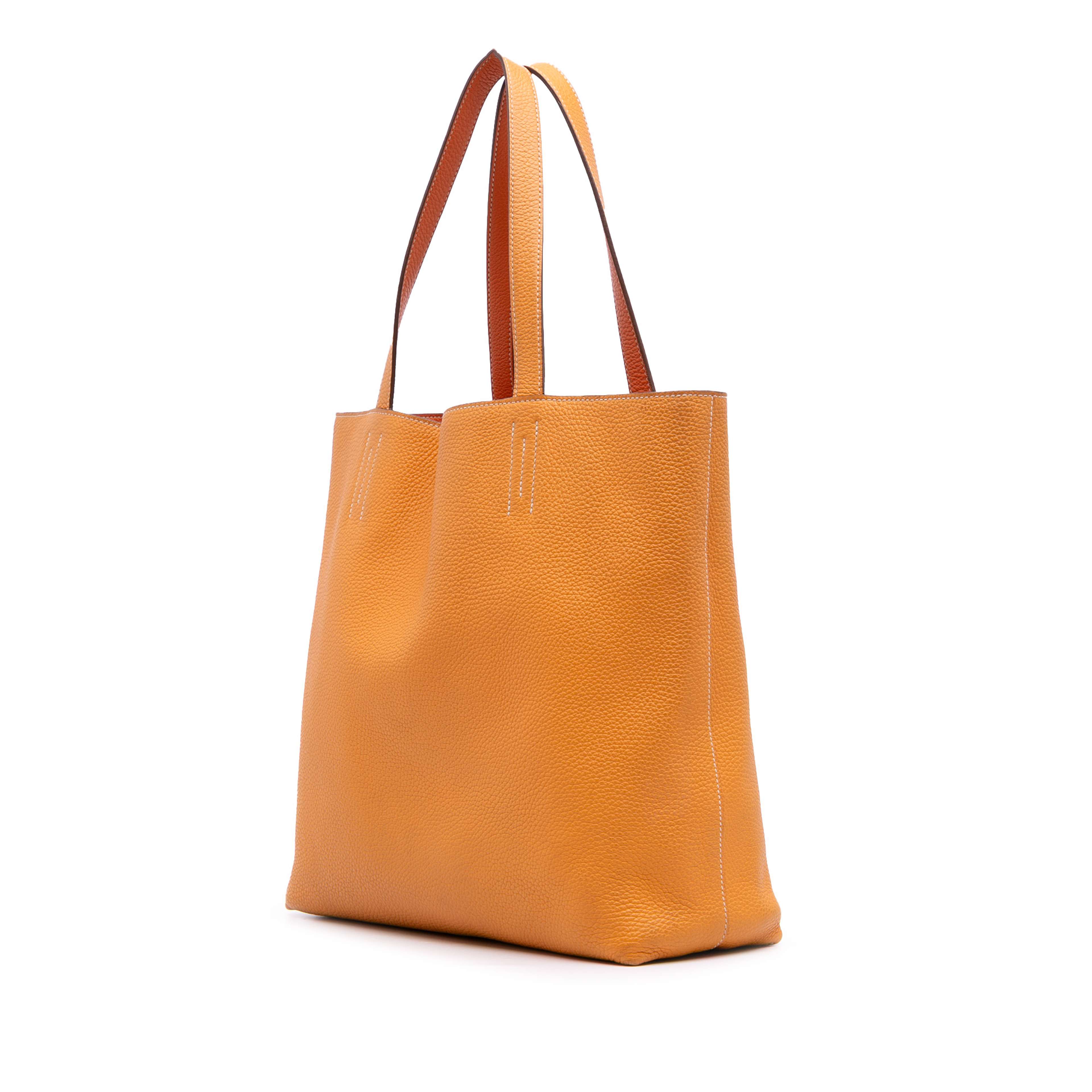 Hermès Clemence Double Sens 36, från Luxclusif, i färgen orange. Klicka för att öppna bilden i stort format